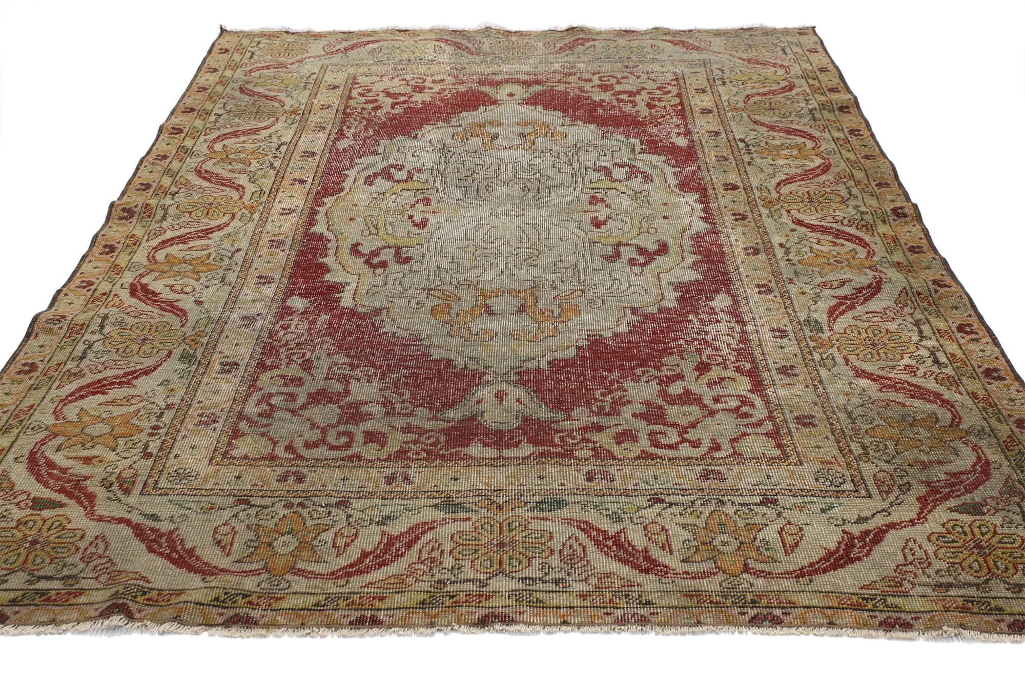 52081 Vintage Turkish Oushak Rug, 04'02 x 06'01.
Balancing traditional design elements with rustic sensibility and nostalgic charm, this hand knotted wool distressed vintage Turkish Oushak rug can beautifully blend modern, traditional, rustic, and