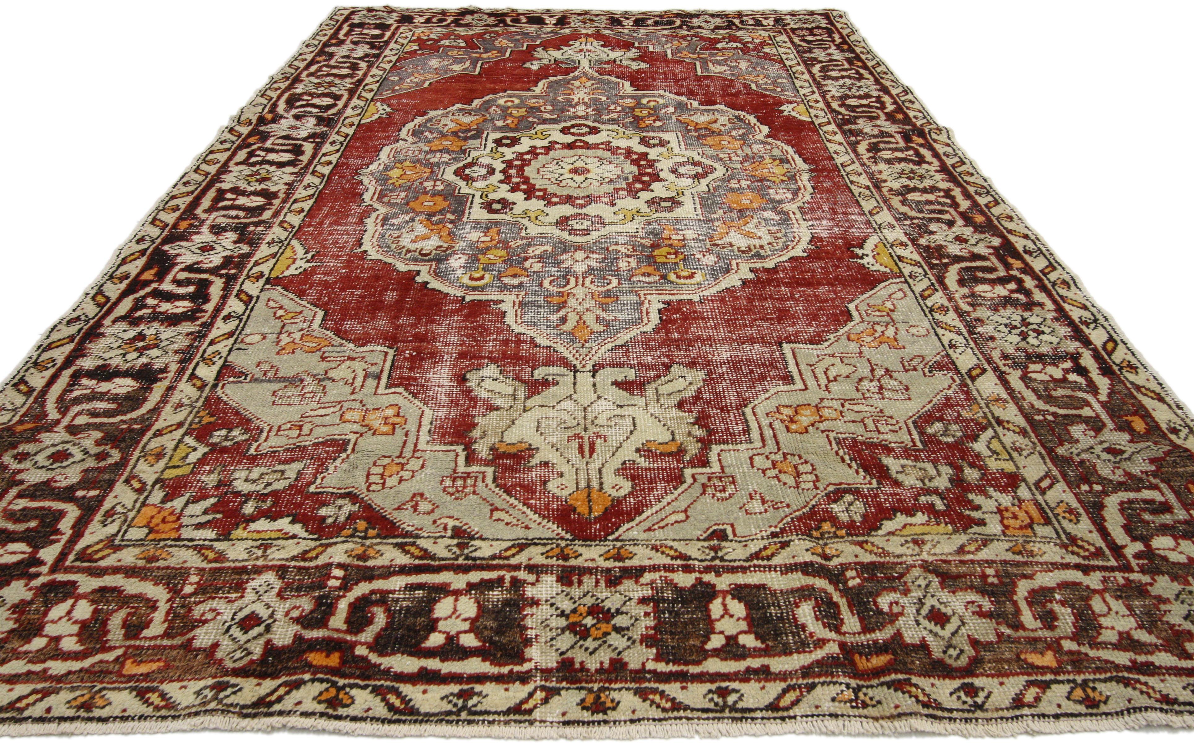 51295 distressed vintage Turkish Oushak rug with rustic Arts & Crafts style. This hand knotted wool distressed vintage Turkish Oushak rug features a cusped medallion with anchor palmette pendants in an abrashed field. Ruby red and slate gray