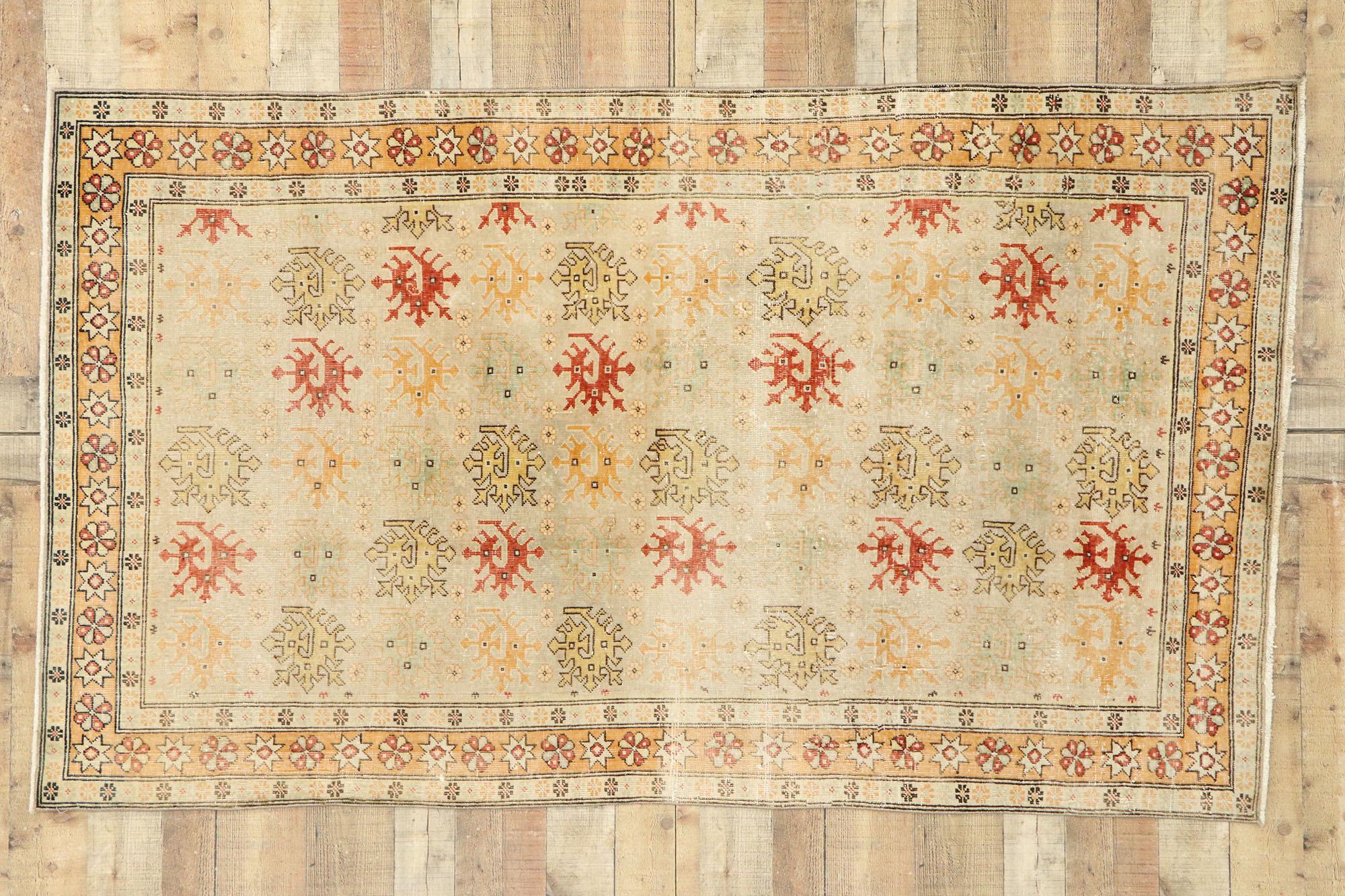 53147, distressed vintage Turkish Oushak rug with Rustic Arts & Crafts style. This hand knotted wool distressed vintage Turkish Oushak rug features an all-over pattern spread across an abrashed ecru field. The pattern is comprised of dragon motifs