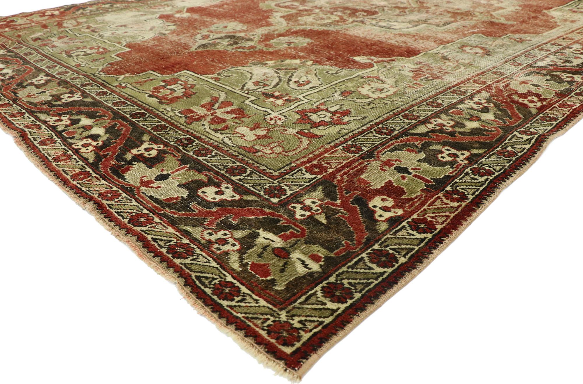52768, distressed vintage Turkish Oushak rug with rustic English Manor style. With warm spice-tones and lovingly timeworn appearance, this hand knotted wool distressed vintage Turkish Oushak rug embraces rustic English Manor style. It features a