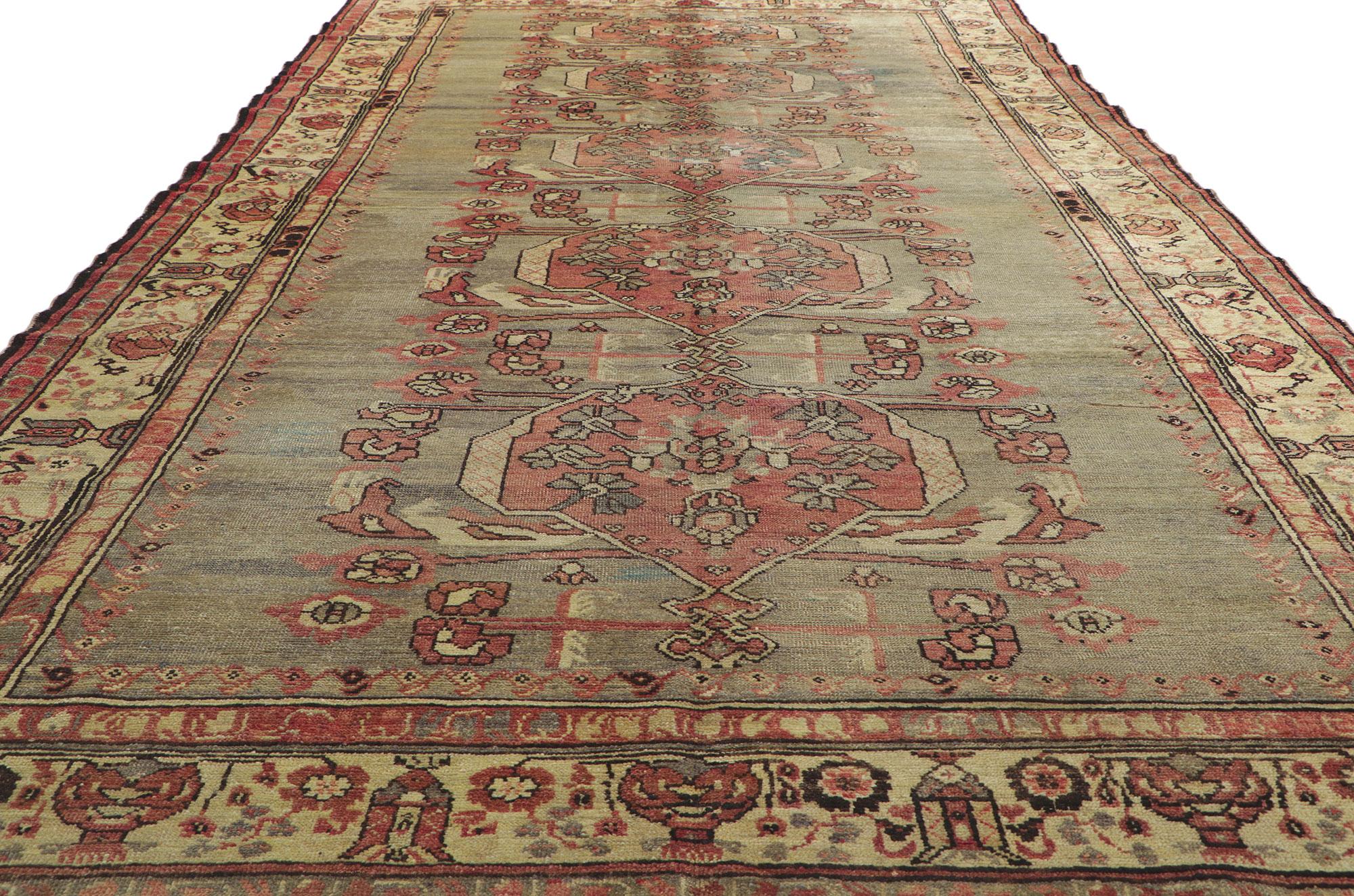 20th Century Distressed Vintage Turkish Oushak Rug with Rustic Modern Industrial Style For Sale