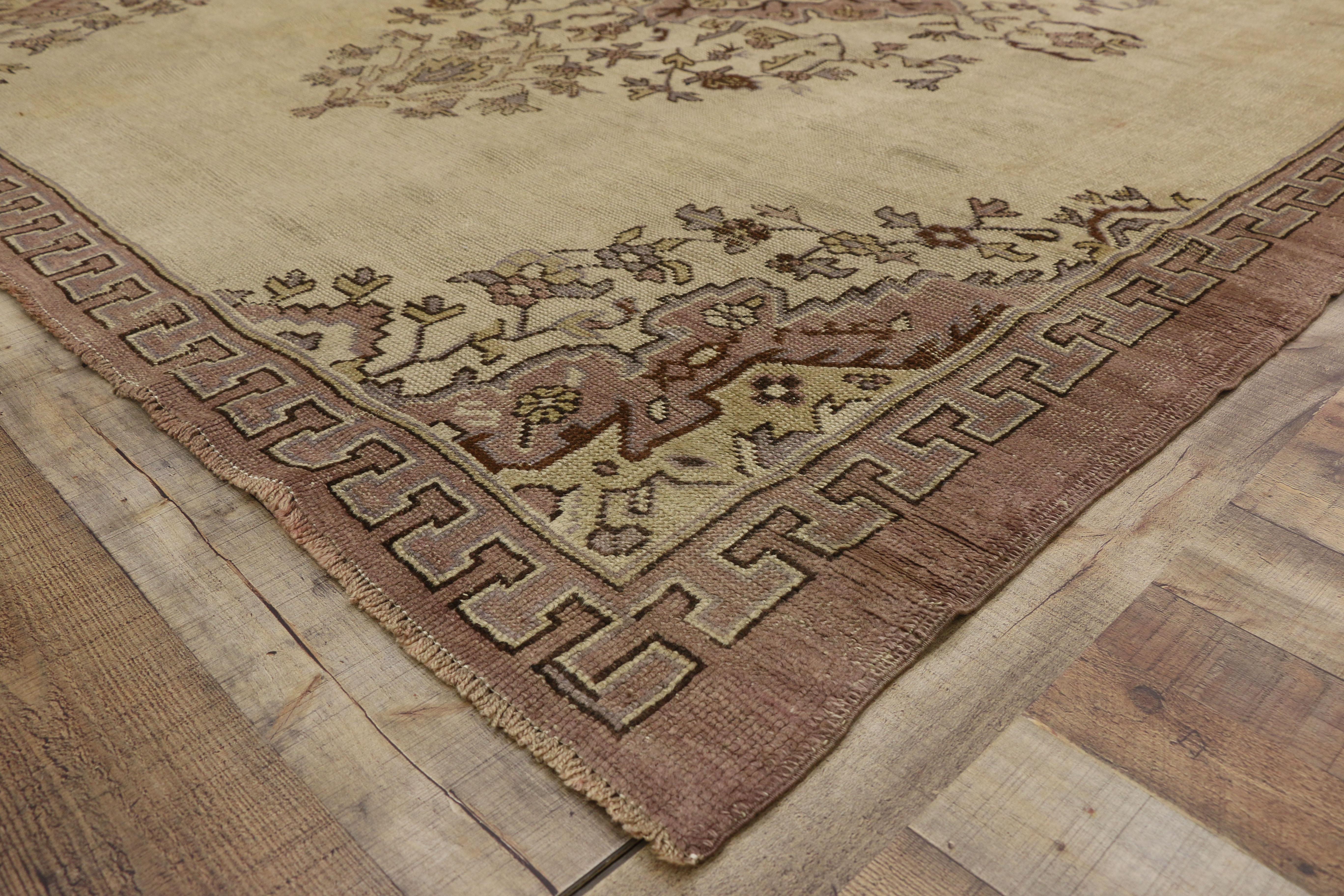 20th Century Distressed Vintage Turkish Oushak Rug with Shabby Chic Rococo Style For Sale