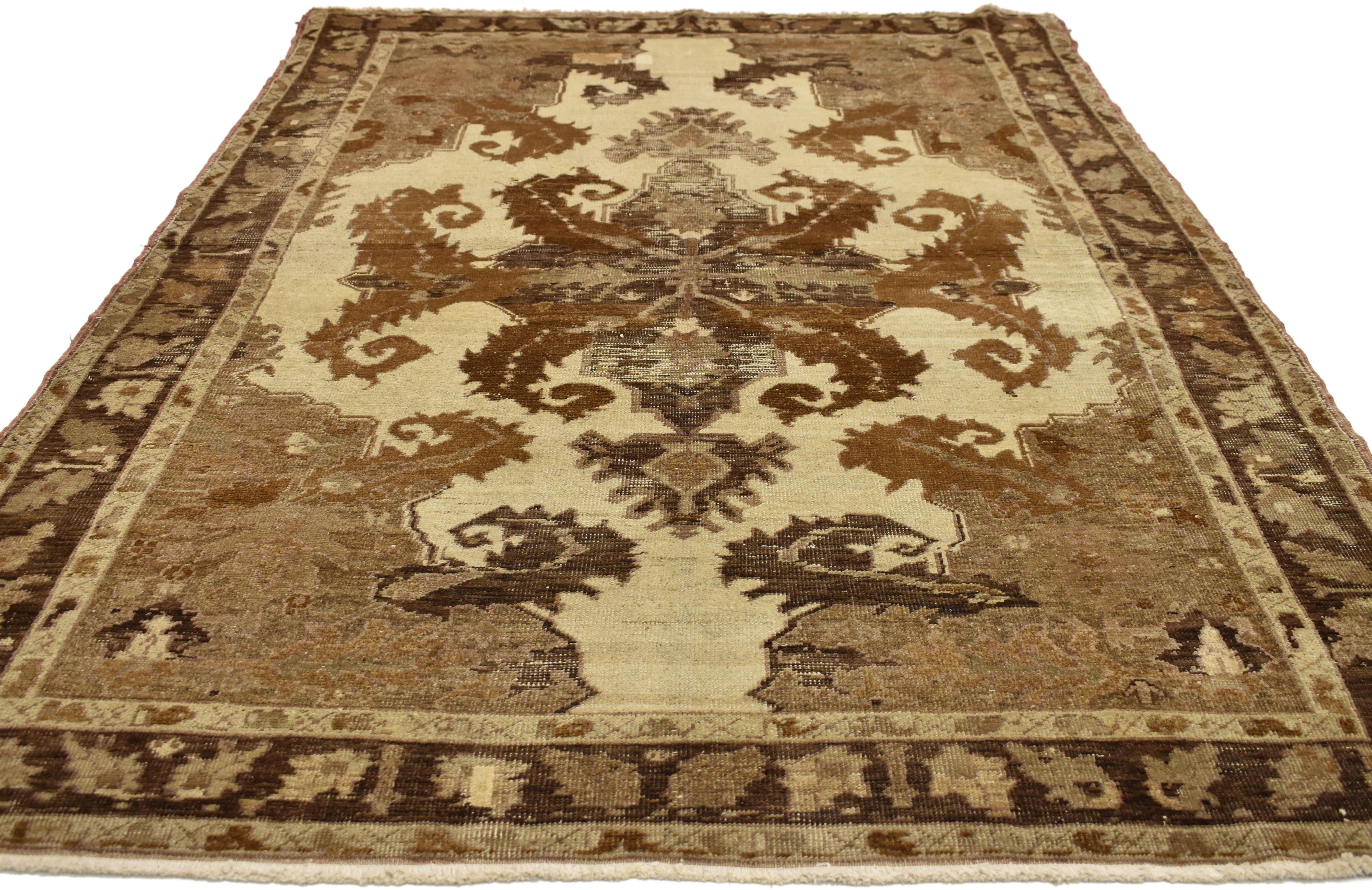 Hand-Knotted Distressed Vintage Turkish Oushak with Black Forest Style, Warm Earth Tones For Sale