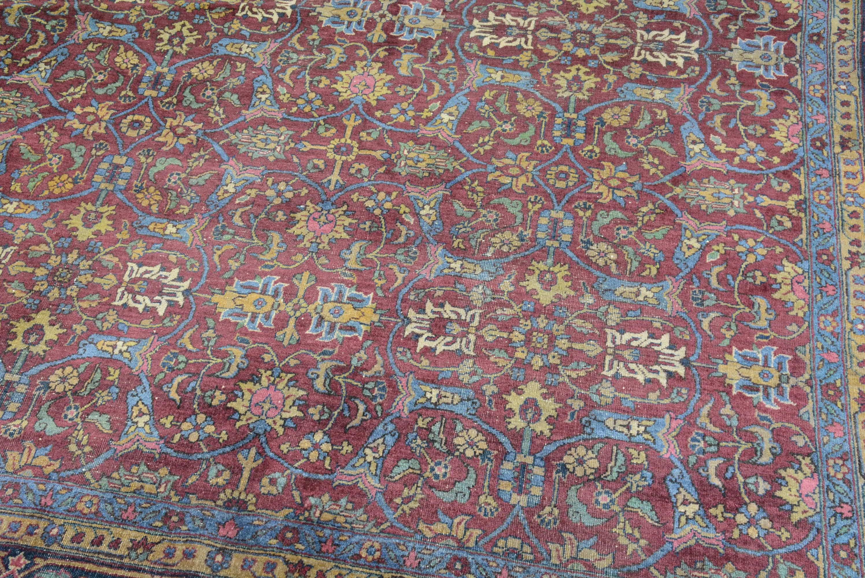 A vintage Turkish Sivas carpet with an overall floral pattern inspired by those woven in Tabriz Persia. Measures: 9' 10