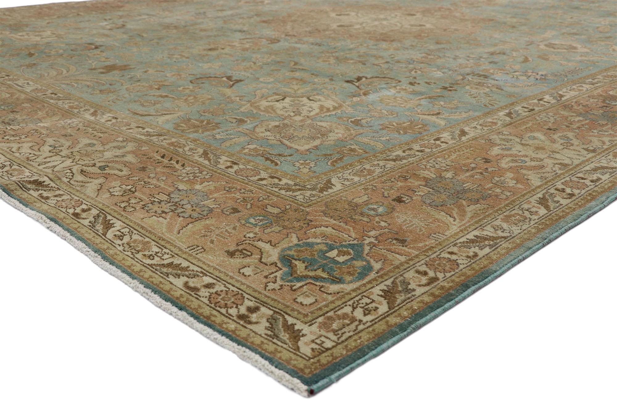 52664 Distressed Vintage Tabriz Rug with Gustavian Style 09'09 x 12'07. The architectural elements of naturalistic forms and timeless elegance combined with Gustavian style, this hand knotted wool distressed vintage Turkish Tabriz rug astounds with