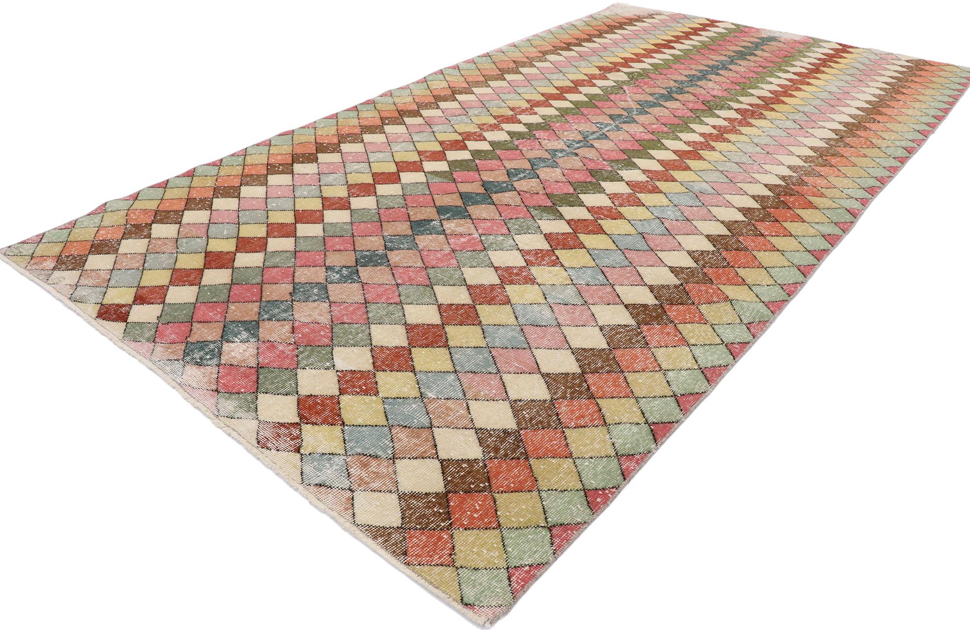 53293, distressed vintage Turkish Sivas rug with Mid-Century Modern Bohemian style. This hand knotted wool distressed vintage Turkish Sivas rug features an all-over diamond pattern comprised of multicolored lozenges. The colors are arranged in a