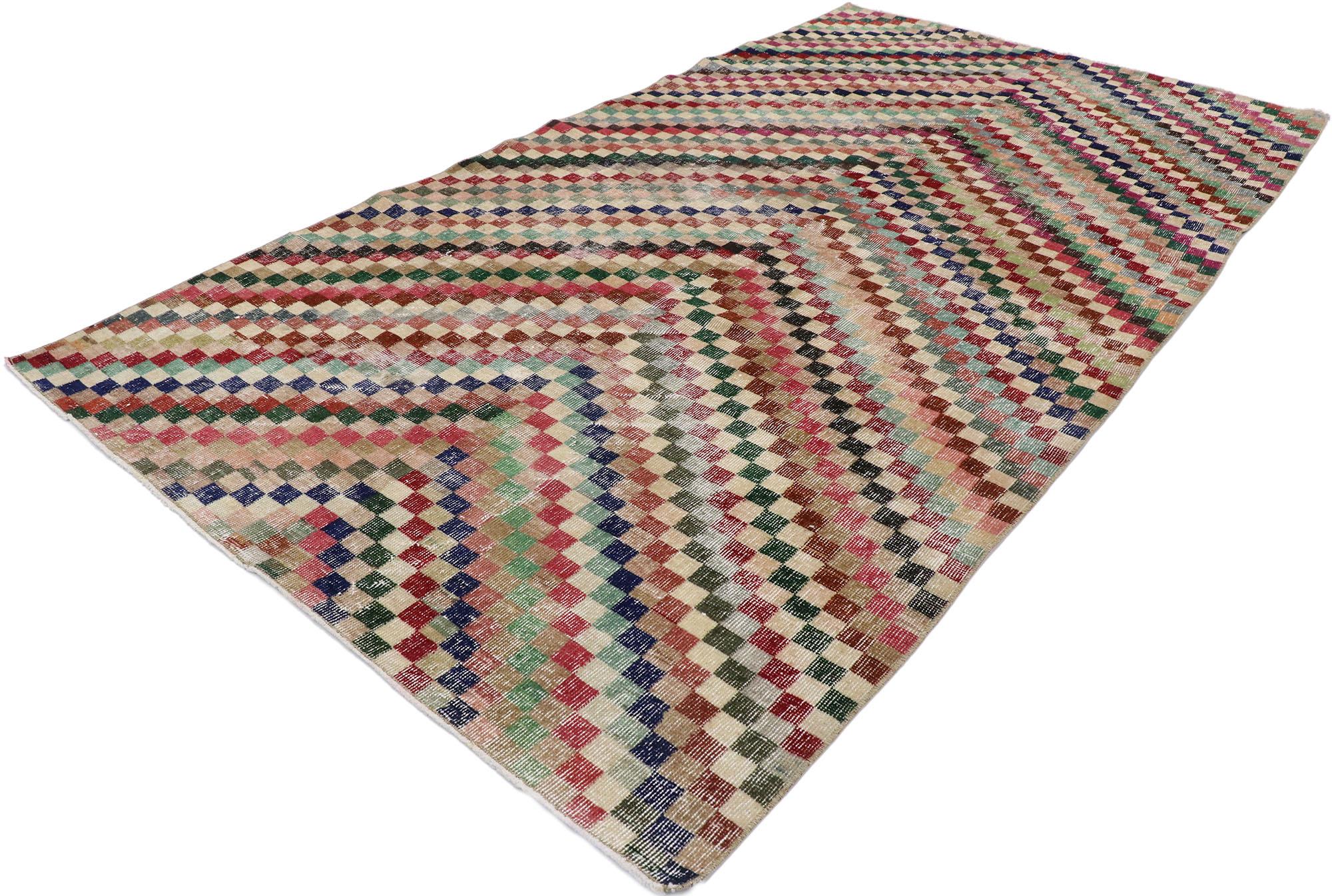 53361 distressed vintage Turkish Sivas rug with Mid-Century Modern Rustic style. This hand knotted wool distressed vintage Turkish Sivas rug features an all-over checkered chevron pattern comprised of rows of multicolored squares. Each row of cubes