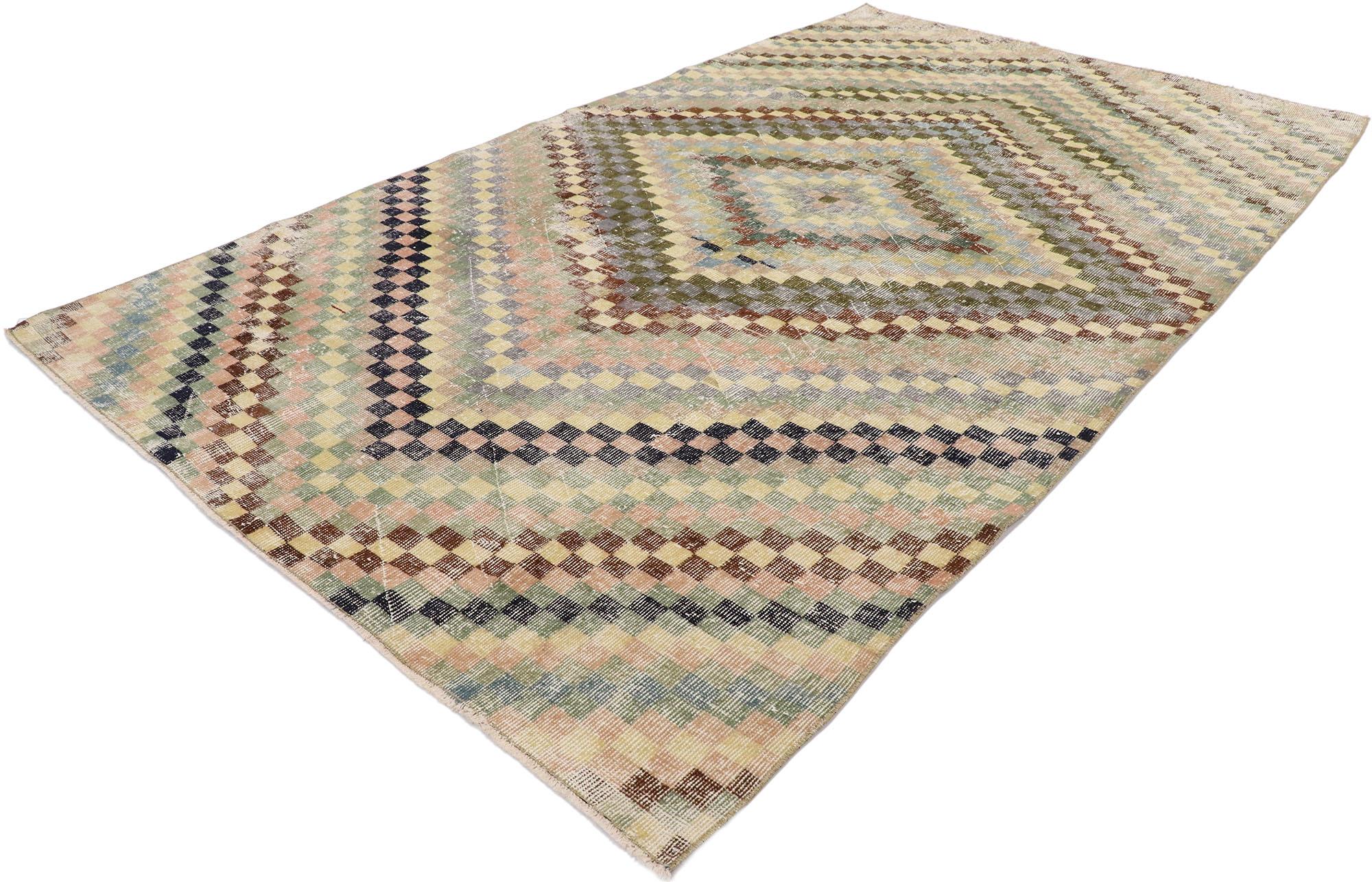 53278, distressed vintage Turkish Sivas rug with Modern Cubist style. This hand knotted wool distressed vintage Turkish Sivas rug features an all-over checkered pattern comprised of rows of multi-colored squares. Color-blocked concentric diamonds