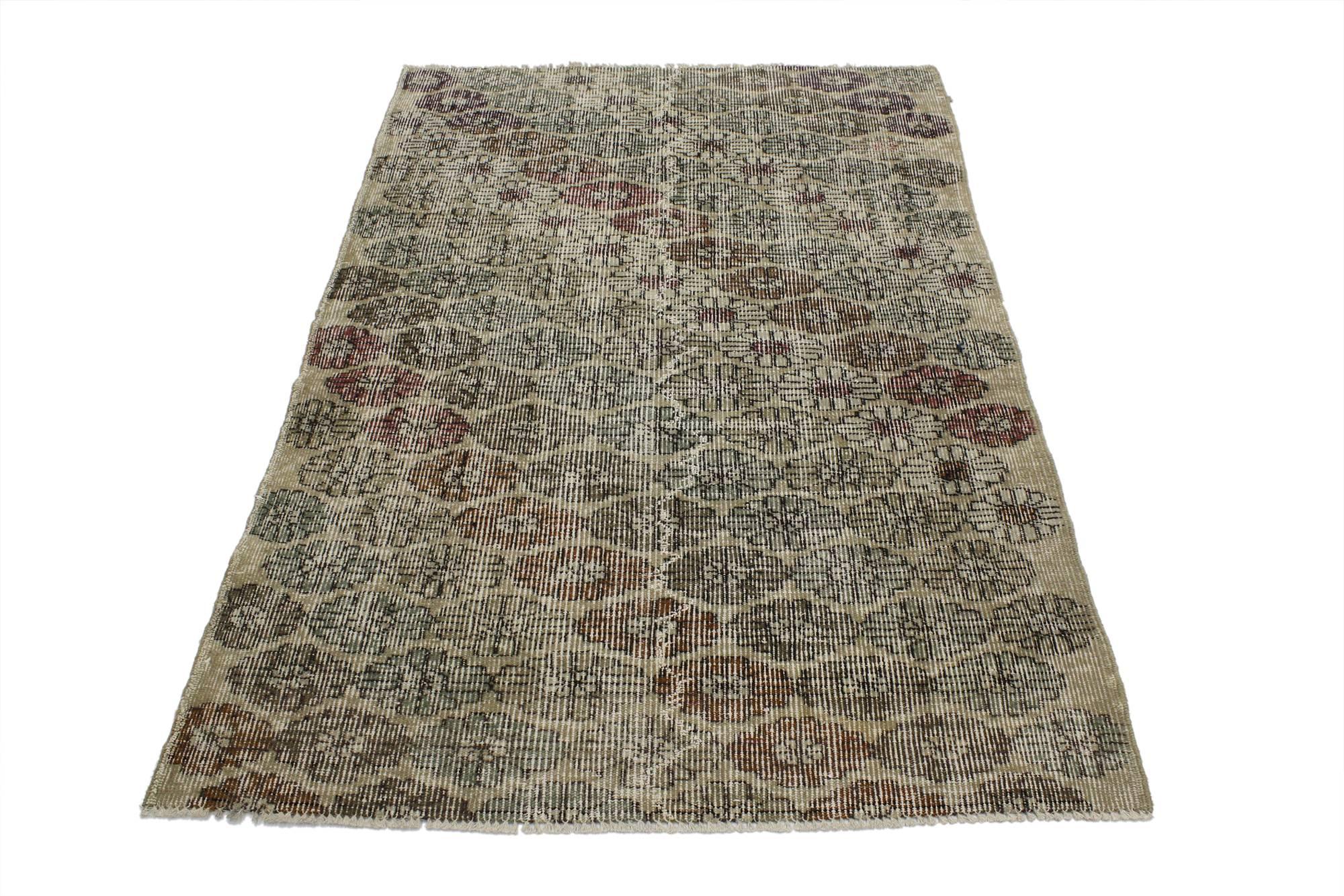 51960, distressed vintage Turkish Sivas rug with modern Industrial Art Deco style. This hand knotted wool distressed vintage Turkish Sivas rug features an all-over floral pattern spread across an abrashed beige field. Offset rows of large rosettes