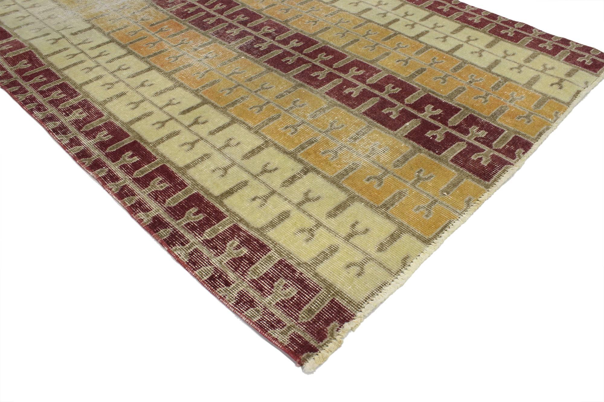 51927 Zeki Muren Distressed Vintage Turkish Sivas rug with Modern Art Deco Style 03'09 x 06'09. Displaying balanced symmetry and bold geometric shapes combined with a lovingly time-worn composition, this hand knotted wool Zeki Muren distressed