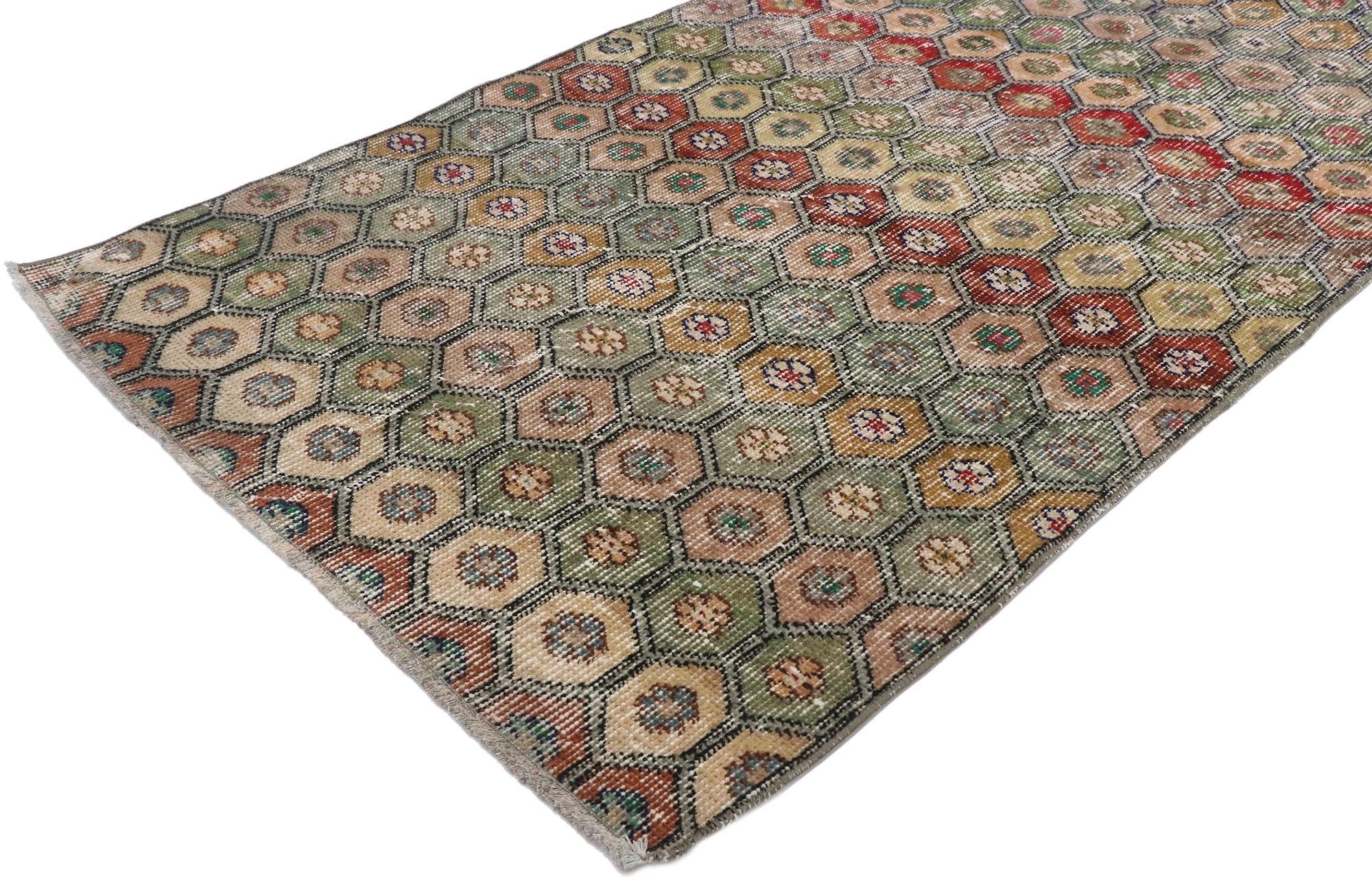 53312 Distressed vintage Turkish Sivas rug with Modern Rustic Bungalow style. This hand knotted wool distressed vintage Turkish Sivas rug features an all-over botanical lattice pattern comprised of ogival shapes embellished with rosette florals. The