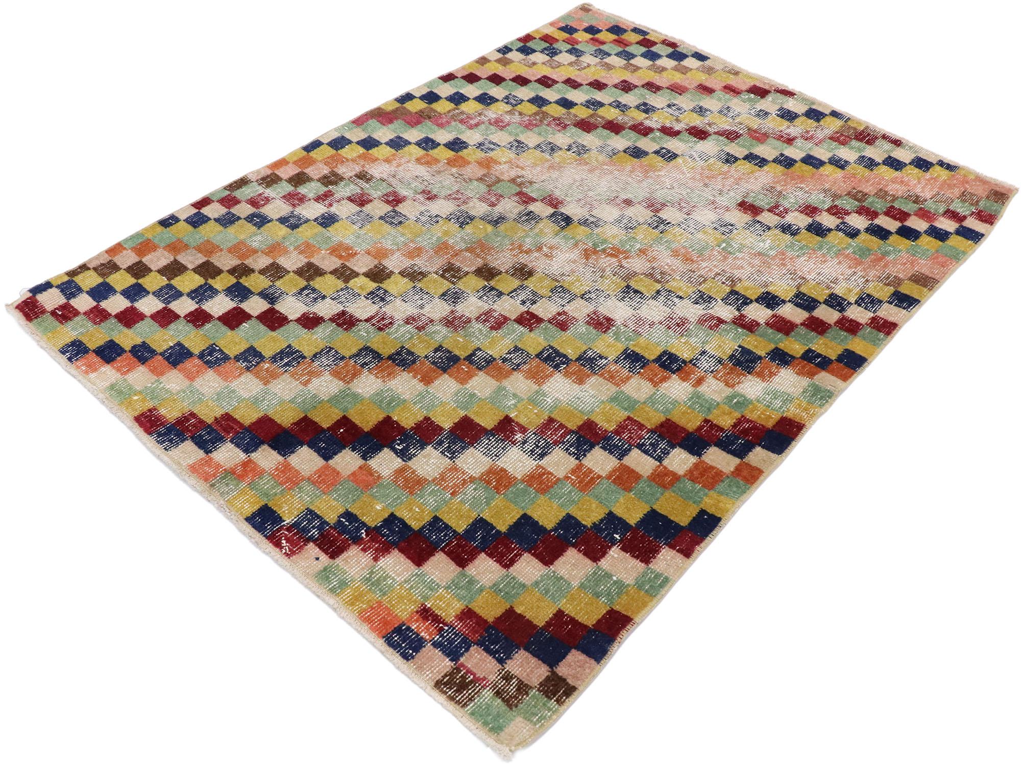 53342, distressed vintage Turkish Sivas rug with Postmodern Cubist style. This hand knotted wool distressed vintage Turkish Sivas rug features an all-over checkered diagonal stripe pattern comprised of rows of multicolored diamonds. Each row of