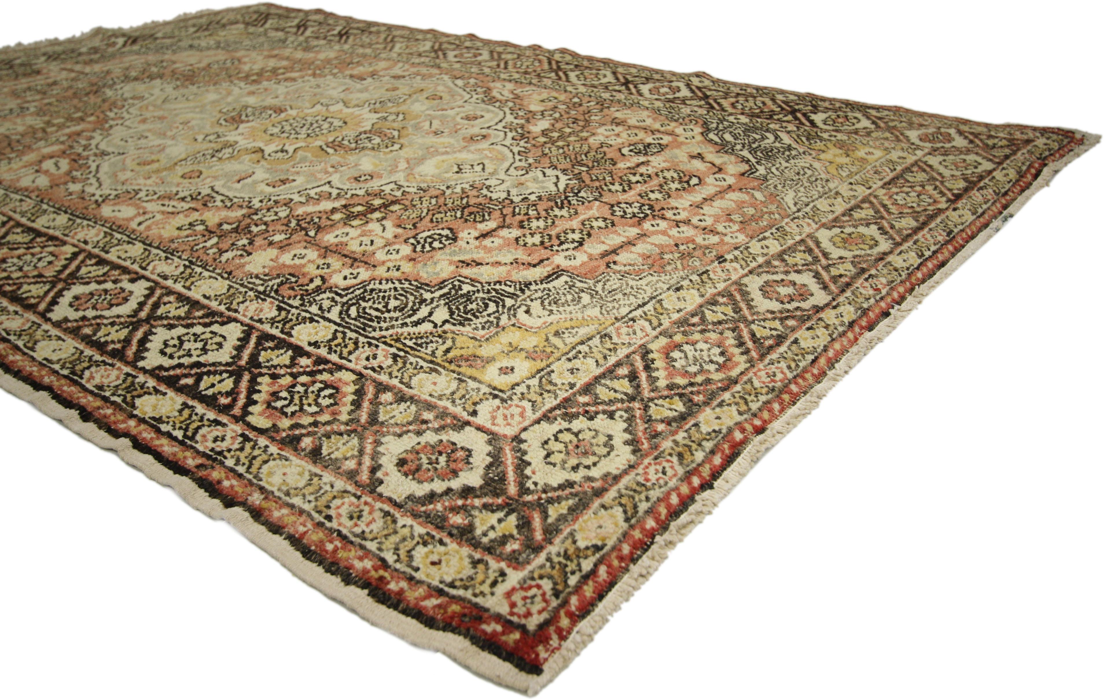 73912 Distressed Vintage Turkish Sivas Rug with Rustic Cottage Arts & Crafts Style. With architectural elements of curved forms and decorative detailing, this hand knotted wool vintage Turkish Sivas rug features a cusped center medallion surrounded