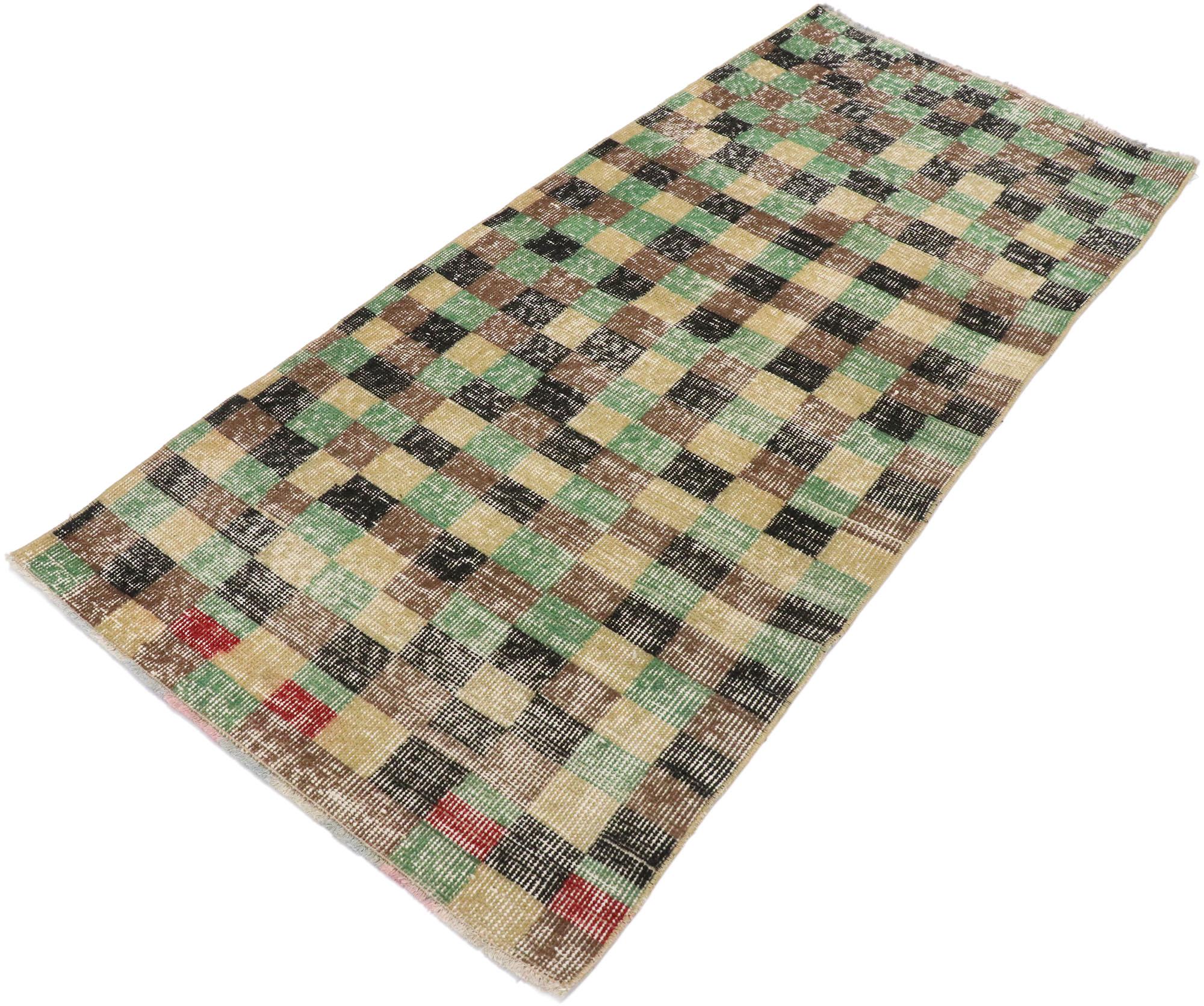 53286 distressed vintage Turkish Sivas rug with Rustic Cubist style. This hand knotted wool distressed vintage Turkish Sivas rug features an all-over checkerboard pattern comprised of alternating green, brown, black, yellow, and red squares. Gentle