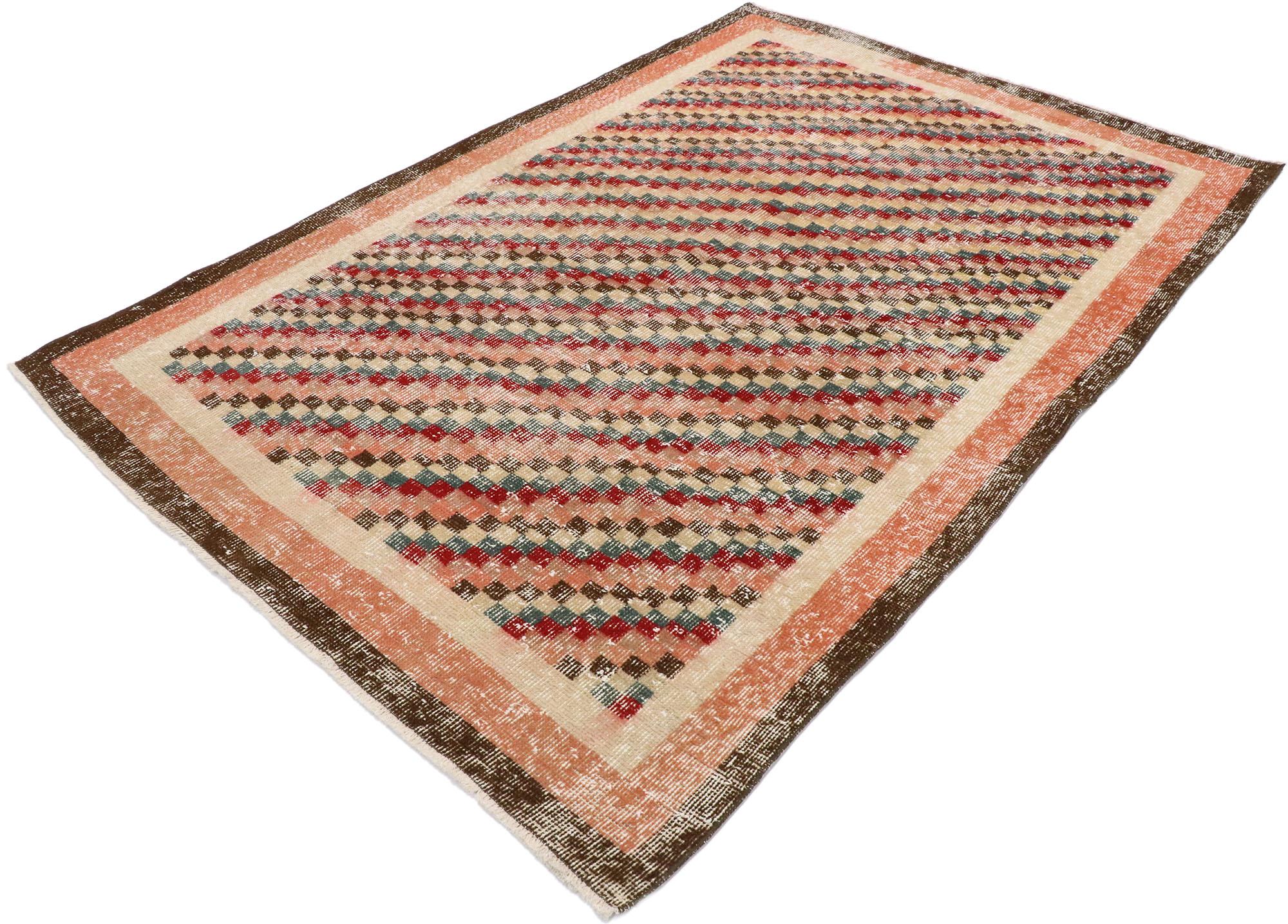 53366 Distressed Vintage Turkish Sivas Rug with Rustic Cubist style. This hand knotted wool distressed vintage Turkish Sivas rug features an all-over checkered diagonal stripe pattern comprised of rows of multicolored squares. Each row of small