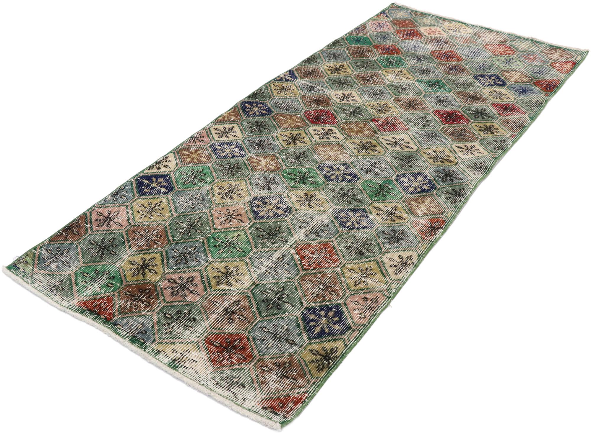 53372, distressed vintage Turkish Sivas rug with Rustic English Country style. This hand knotted wool distressed vintage Turkish Sivas rug features an attractive all-over lattice pattern comprised of multi-colored hexagons decorated with floral
