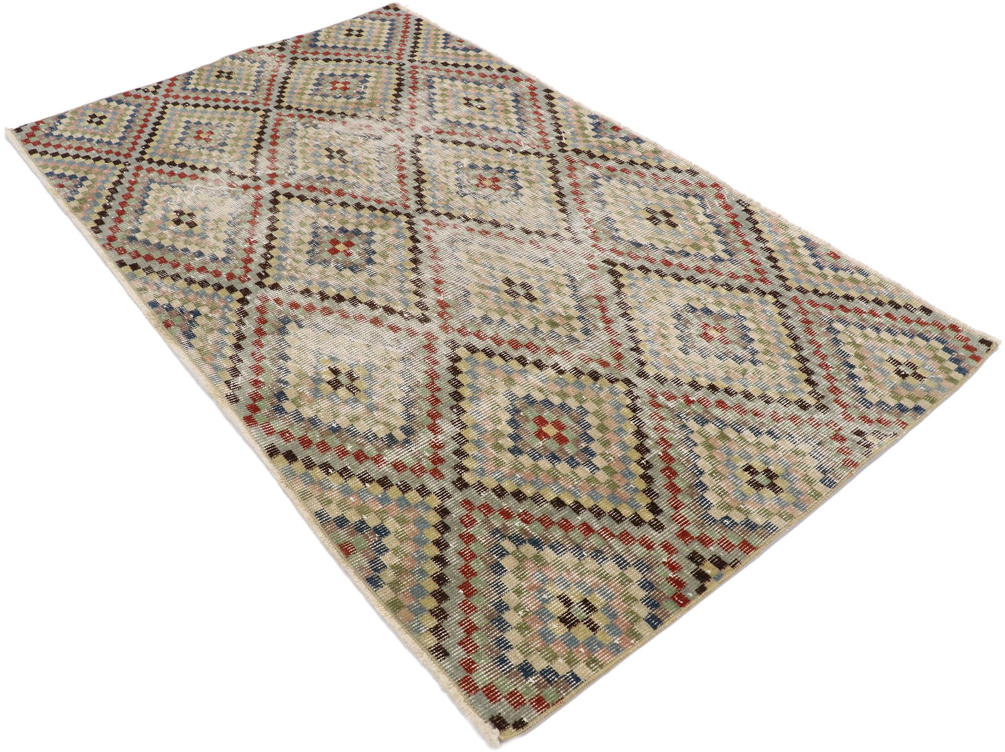 53341, distressed vintage Turkish Sivas rug with Rustic Mid-Century Modern Cubist style. This hand knotted wool distressed vintage Turkish Sivas rug features an all-over checkered diamond lozenge lattice pattern comprised of rows of multicolored