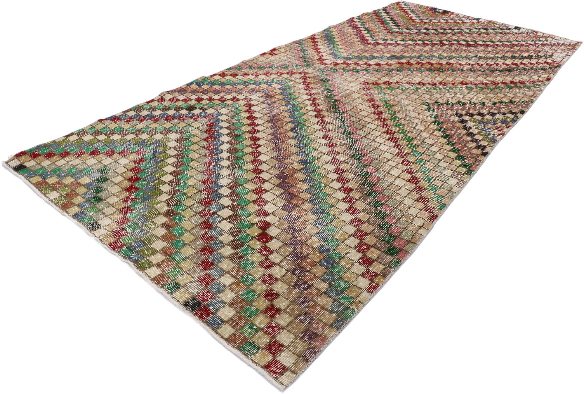 53324, distressed vintage Turkish Sivas rug with Rustic Mid-Century Modern Cubist style. This hand knotted wool distressed vintage Turkish Sivas rug features an all-over checkered asymmetrical chevron pattern comprised of rows of multicolored cubes