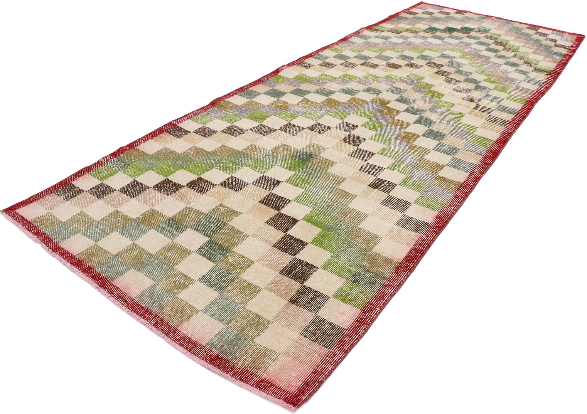 53369 distressed vintage Turkish Sivas rug with rustic Mid-Century Modern cubist style, this hand knotted wool distressed vintage Turkish Sivas rug features an all-over checkered chevron pattern comprised of rows of multi-colored squares. Each row