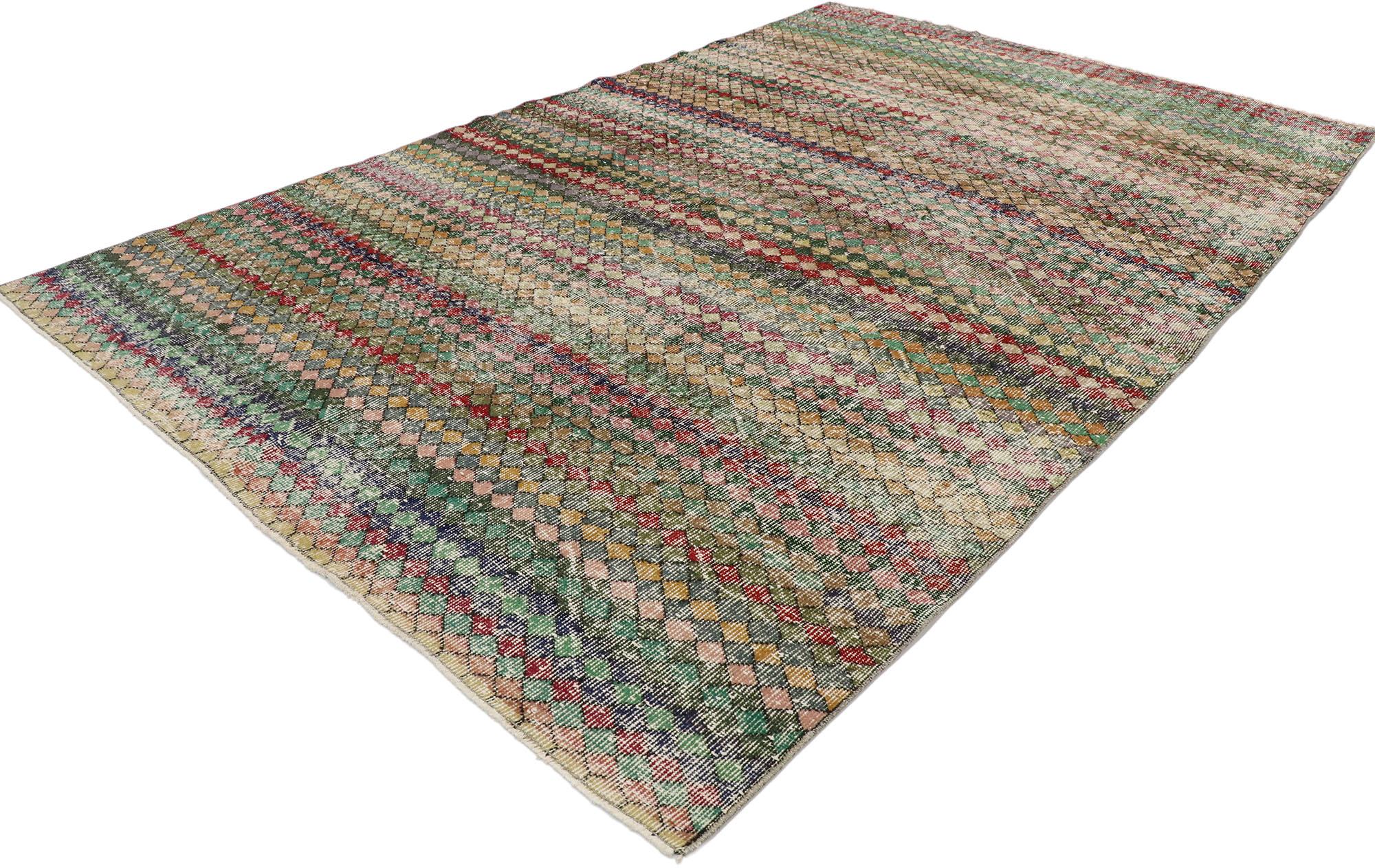 53295 distressed vintage Turkish Sivas rug with rustic Mid-Century Modern style. This hand knotted wool distressed vintage Turkish Sivas rug features an all-over checkerboard pattern comprised of small multicolored diamonds. Gentle waves of abrash