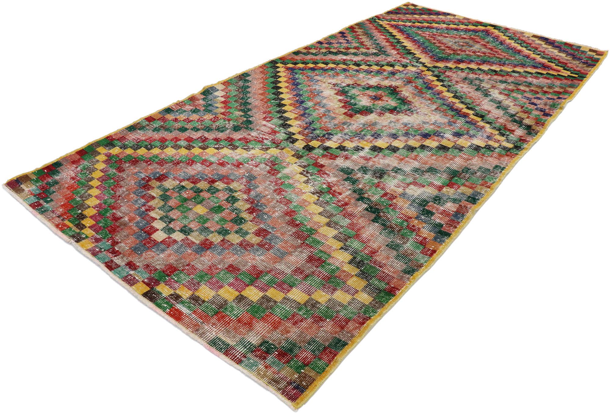 53294 distressed vintage Turkish Sivas rug with rustic Mid-Century Modern style. This hand knotted wool distressed vintage Turkish Sivas rug features an all-over checkerboard pattern comprised of multicolored squares. The colors are arranged in a