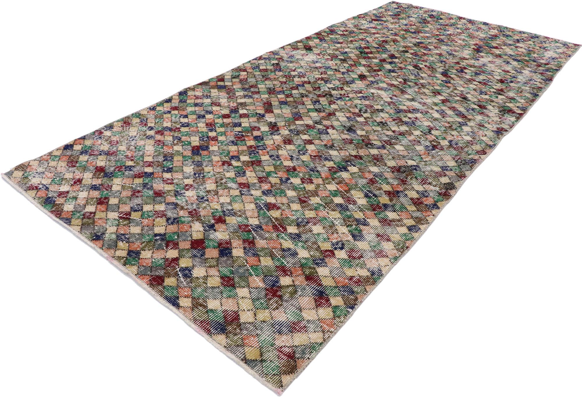 53320 Distressed vintage Turkish Sivas rug with rustic Mid-Century Modern style. This hand knotted wool distressed vintage Turkish Sivas rug features an all-over checkered pattern comprised of multicolored diamonds. Gentle waves of abrash and