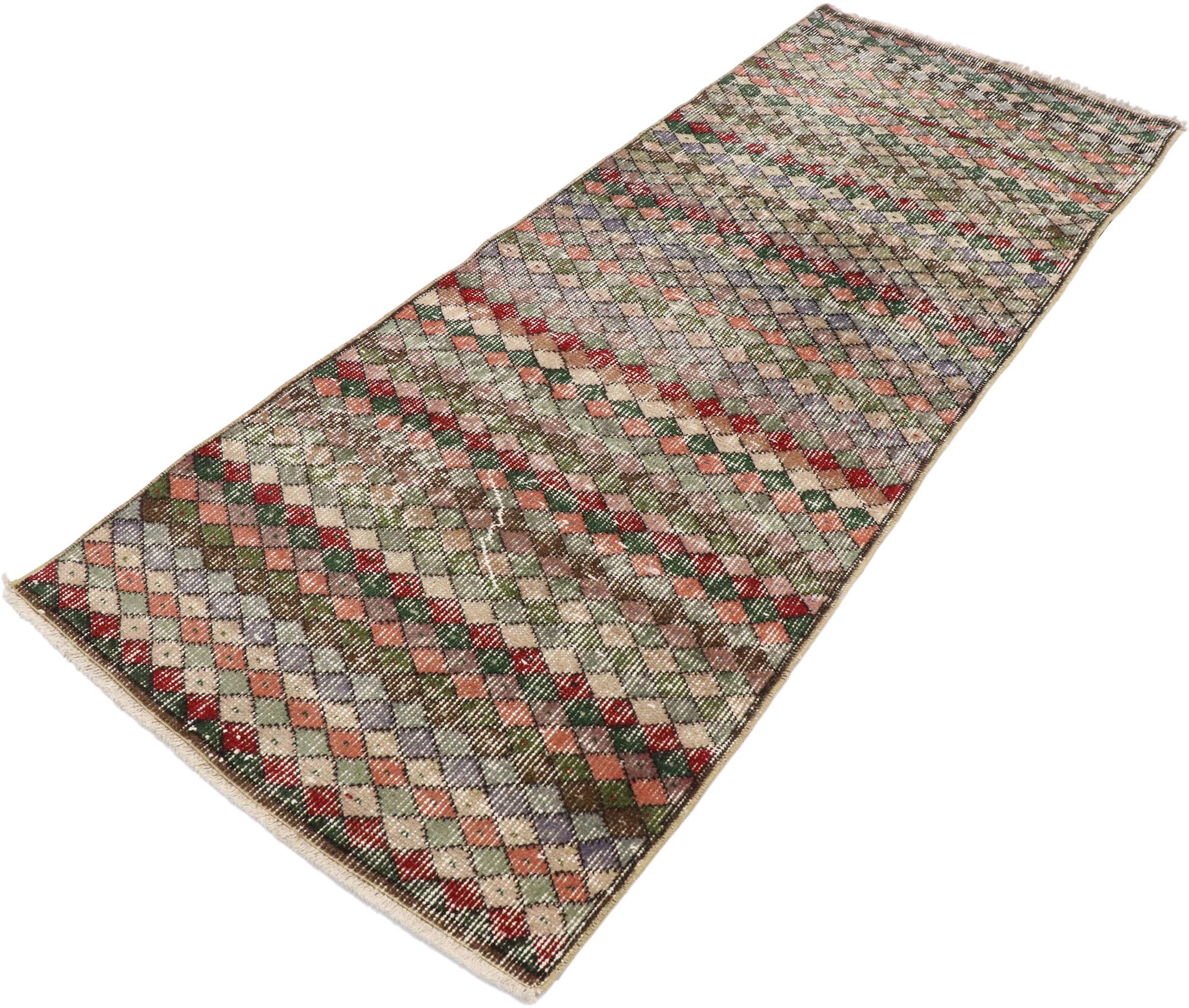 53374 Distressed Vintage Turkish Sivas Rug with Rustic Mid-Century Modern Style 02'03 x 05'09. This hand-knotted wool distressed vintage Turkish Sivas rug features an all-over geometric pattern comprised of multi-colored diamonds. Gentle waves of