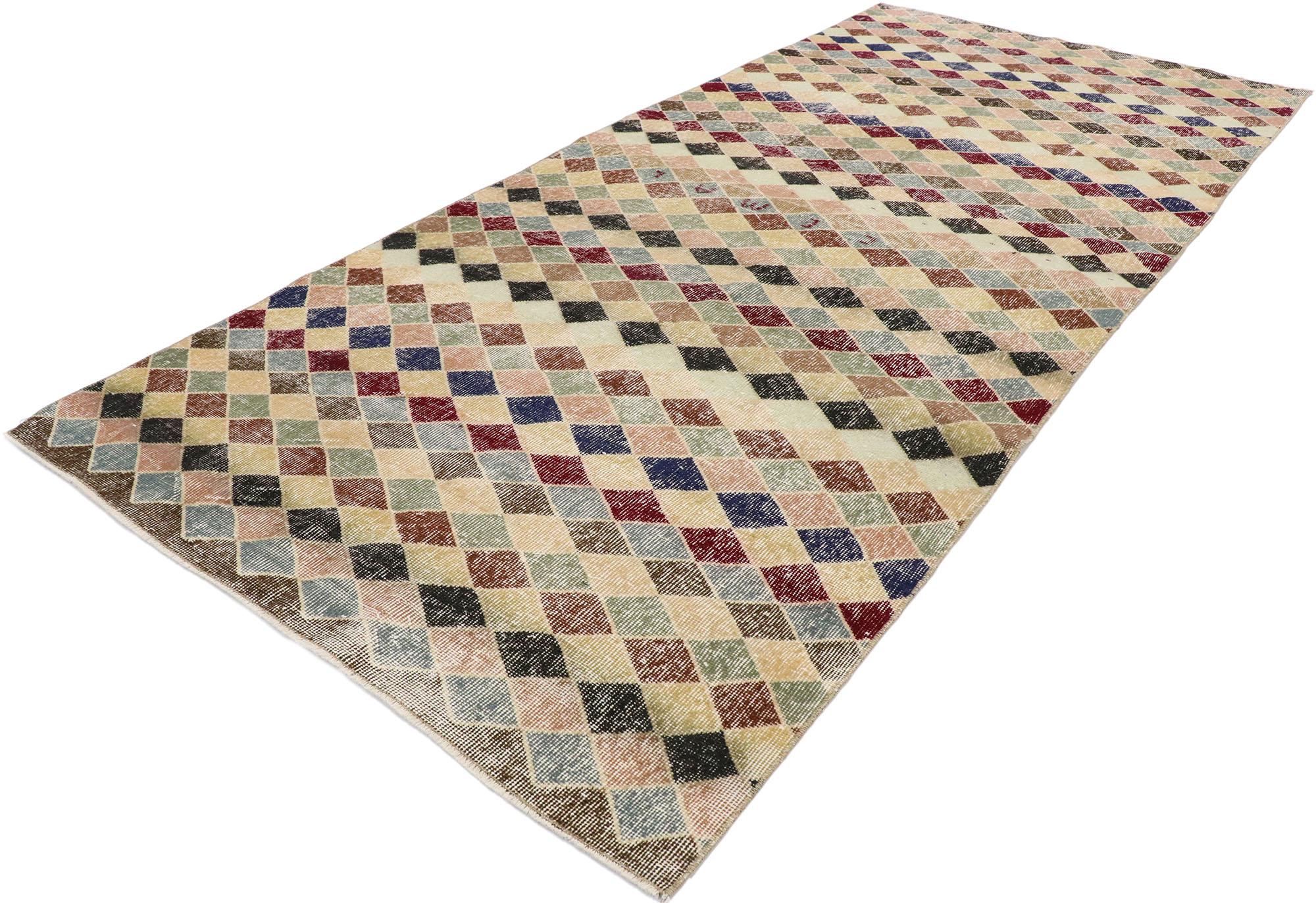 53363, distressed vintage Turkish Sivas rug with rustic Mid-Century Modern style. This hand knotted wool distressed vintage Turkish Sivas rug features an all-over checkerboard pattern comprised of multicolored diamonds. Gentle waves of abrash and