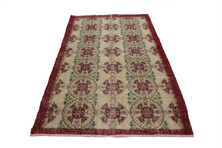 51973 Distressed Vintage Turkish Sivas Rug with Shabby Chic English Country Style. This hand knotted wool distressed vintage Turkish Sivas rug features alternating columns of rose bouquets and round medallions filled rose bouquets exuding comfort