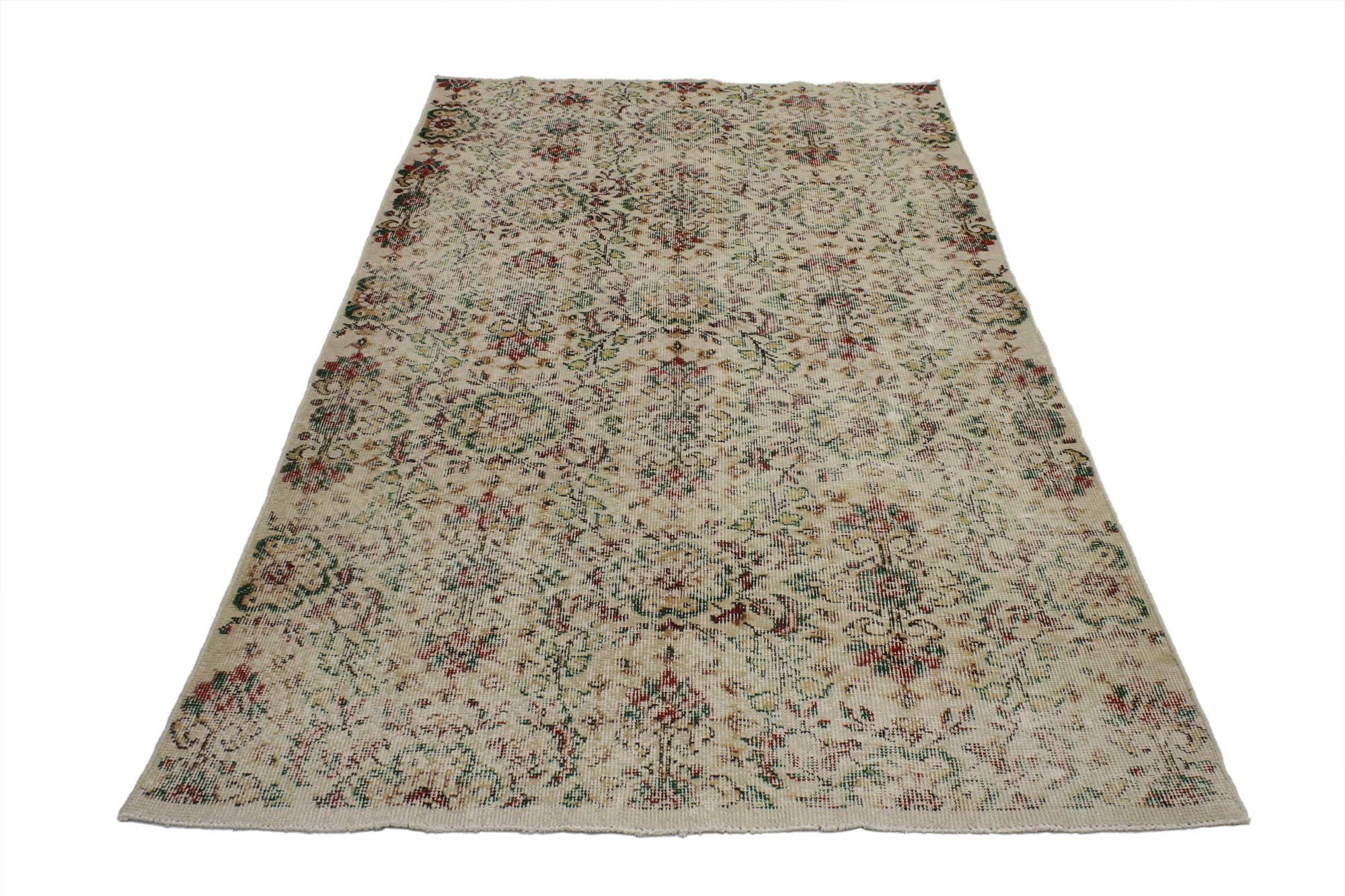 52011, distressed vintage Turkish Sivas rug with shabby chic farmhouse style. This hand-knotted wool distressed vintage Turkish Sivas rug features a shabby chic farmhouse style. The all-over floral pattern is composed of lush flowers and cruciform