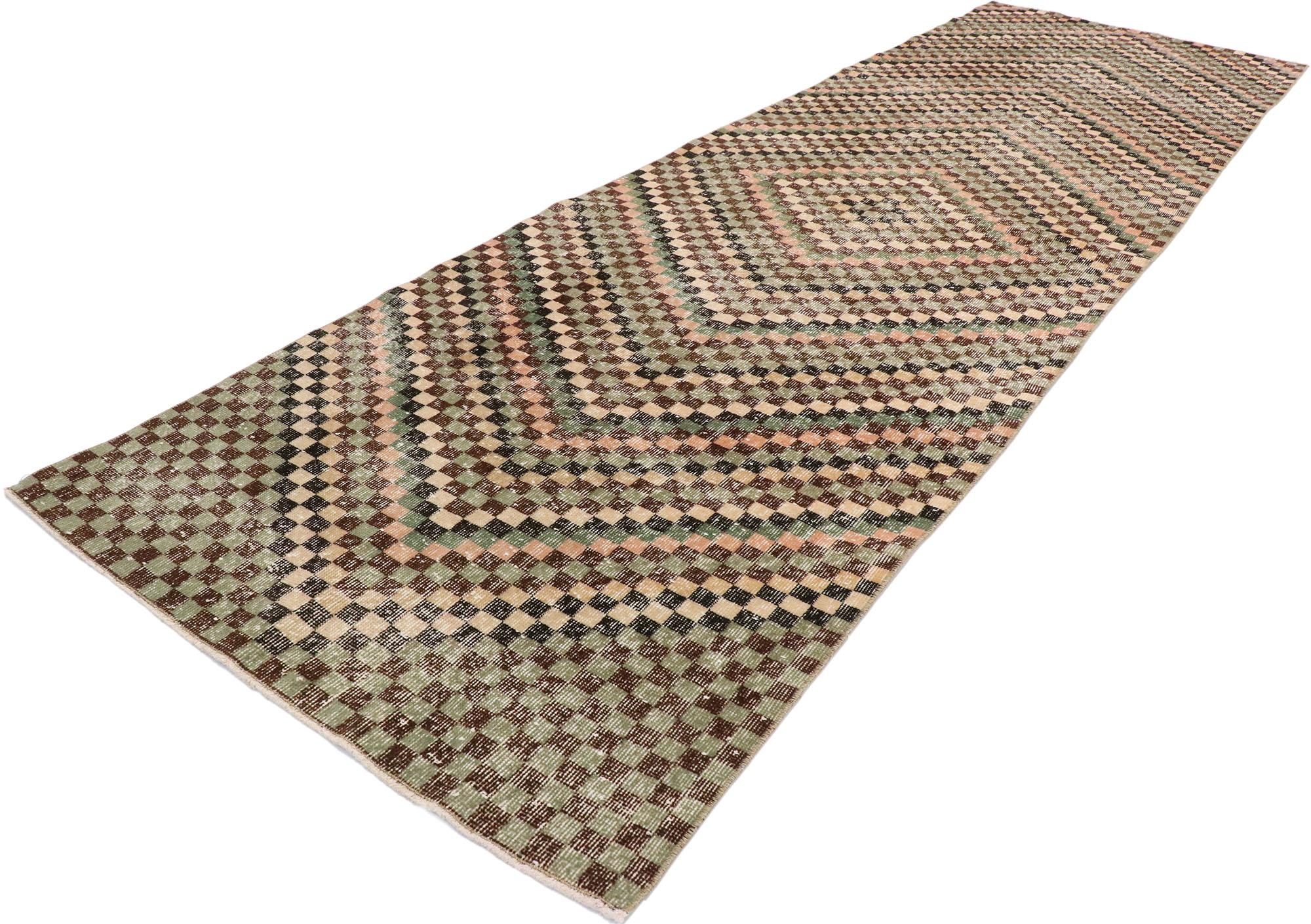 53364, distressed vintage Turkish Sivas runner with rustic Mid-Century Modern Cubist style. This hand knotted wool distressed vintage Turkish Sivas rug features an all-over checkered diamond pattern comprised of rows of multi-colored cubes. Each row