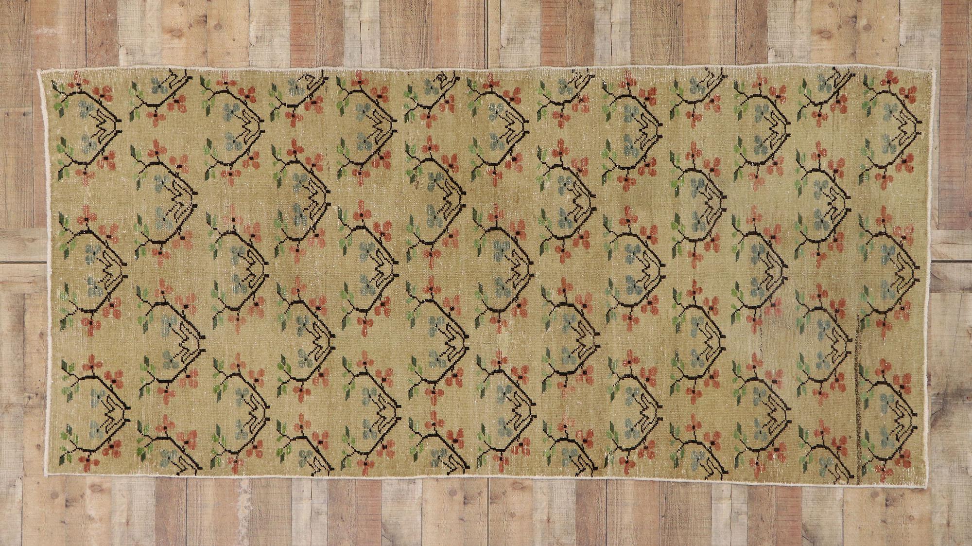 53252, distressed Vintage Turkish Sivas runner with romantic Arts & Crafts style. This hand knotted wool distressed vintage Turkish Sivas runner features an all-over floral pattern spread across an abrashed beige field. Offset rows of repeated