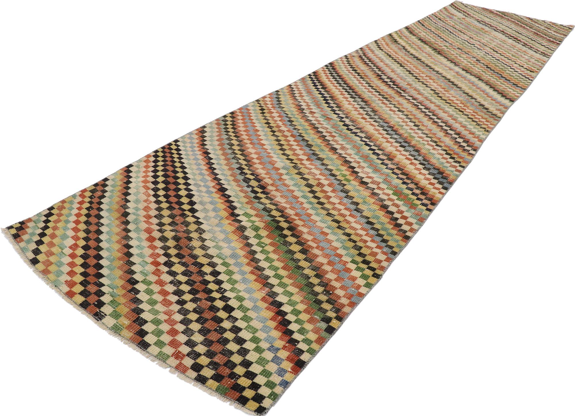 53335, Distressed Vintage Turkish Sivas Runner with Rustic Cubist Style. This hand knotted wool distressed vintage Turkish Sivas rug features an all-over checkered diagonal stripe pattern comprised of rows of multi-colored diamonds. Each row of