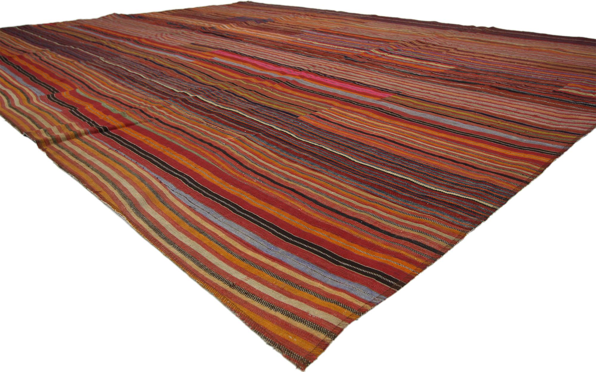 60647 Distressed Vintage Turkish Striped Kilim Rug, 08'08 x 11'05. 
Weathered charm and rugged beauty collides with rustic sensibility in this handwoven wool vintage Turkish kilim rug. The striped panel design and lively colors woven into this piece