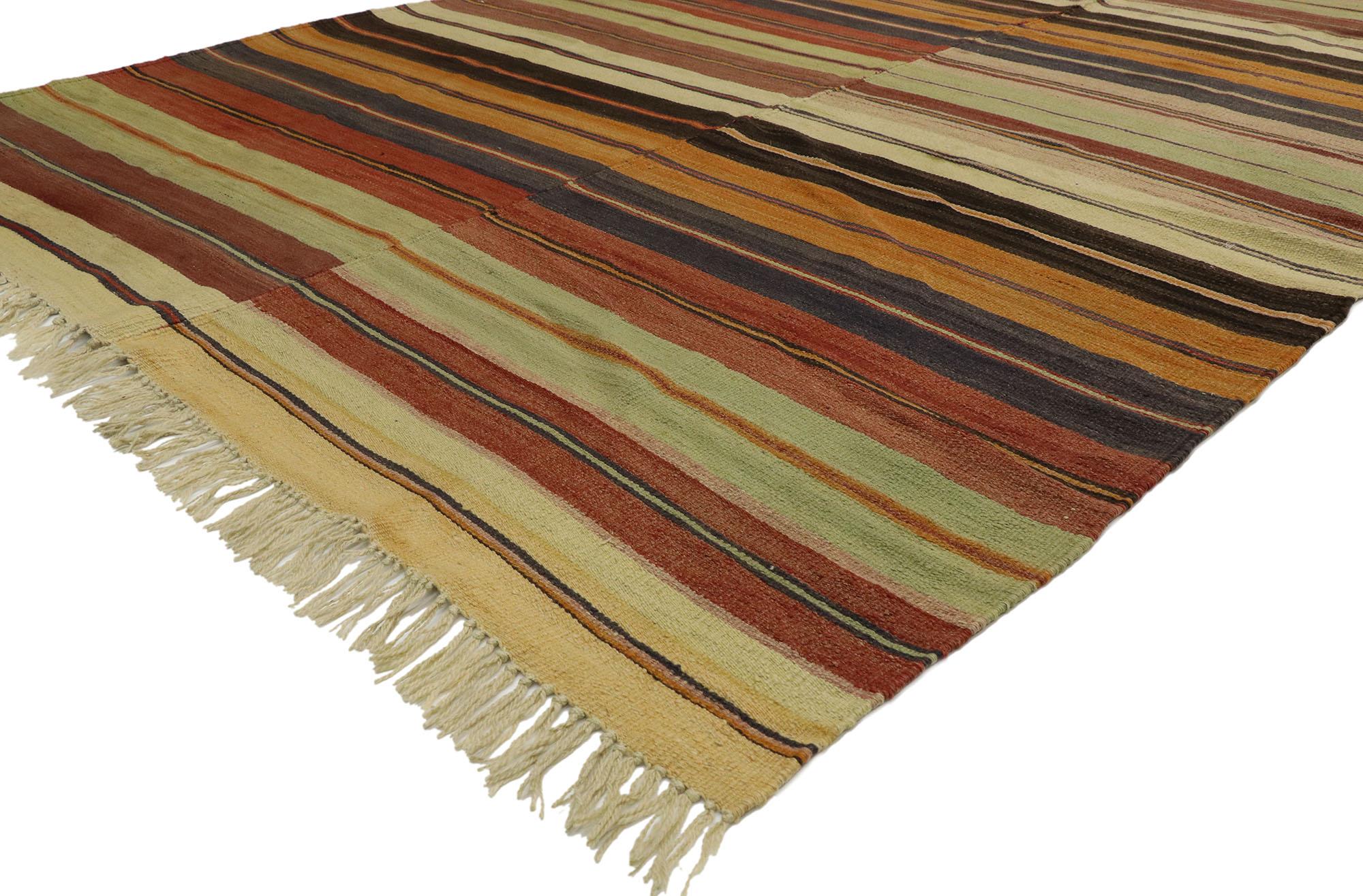53130, distressed vintage Turkish Striped Kilim rug with Modern Rustic Cabin style. With its warm hues and rugged beauty, this handwoven wool striped Kilim rug manages to meld contemporary, modern, and Traditional Design elements. The flat-weave