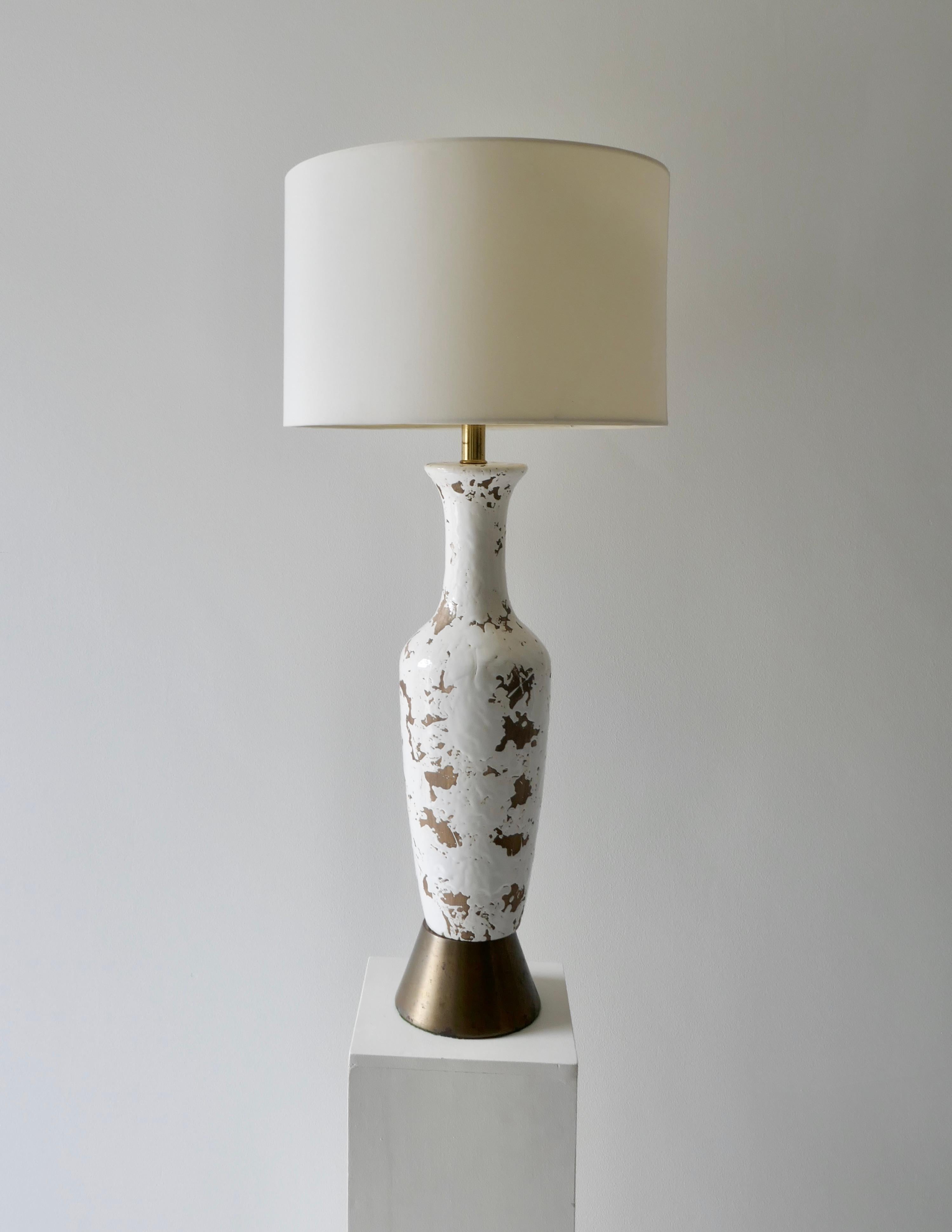 Distressed white tall mid century American ceramic table lamp with brass base
Perfect in a living room or bedroom 
New lampshade.

 