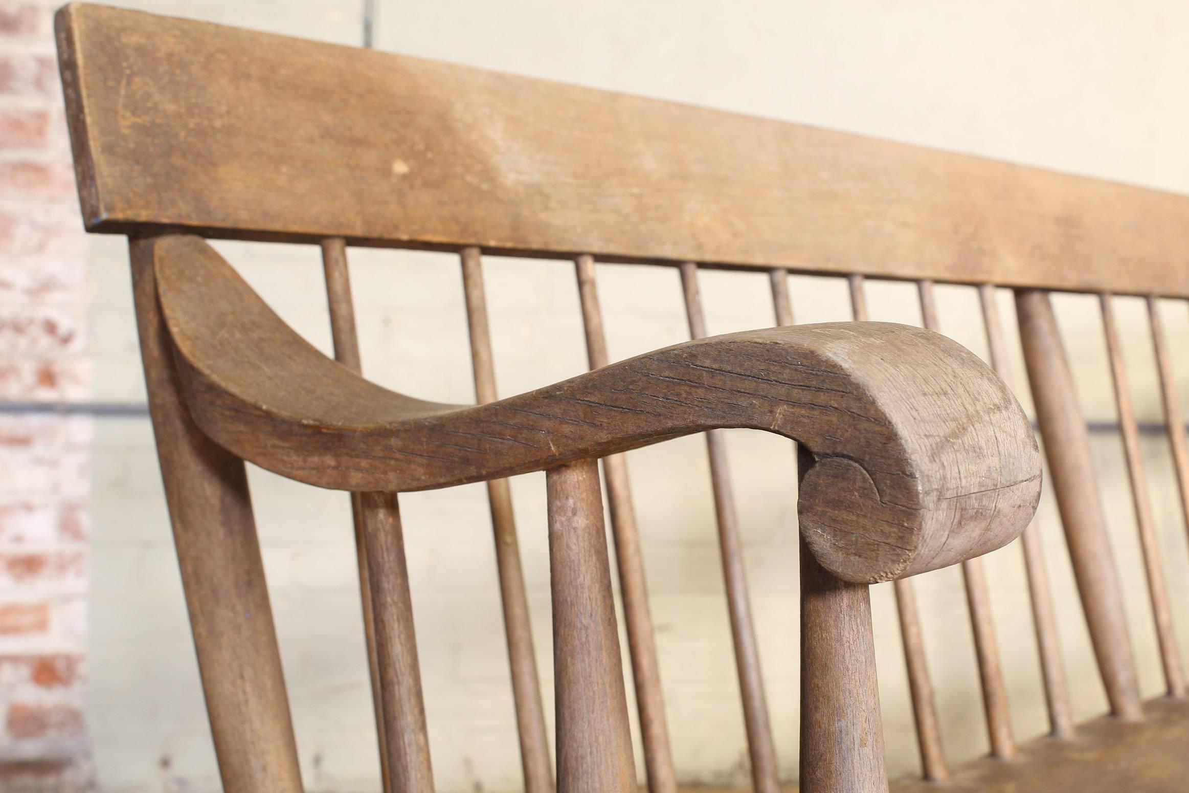 Distressed windsor deacon's style wooden bench. Measures 97