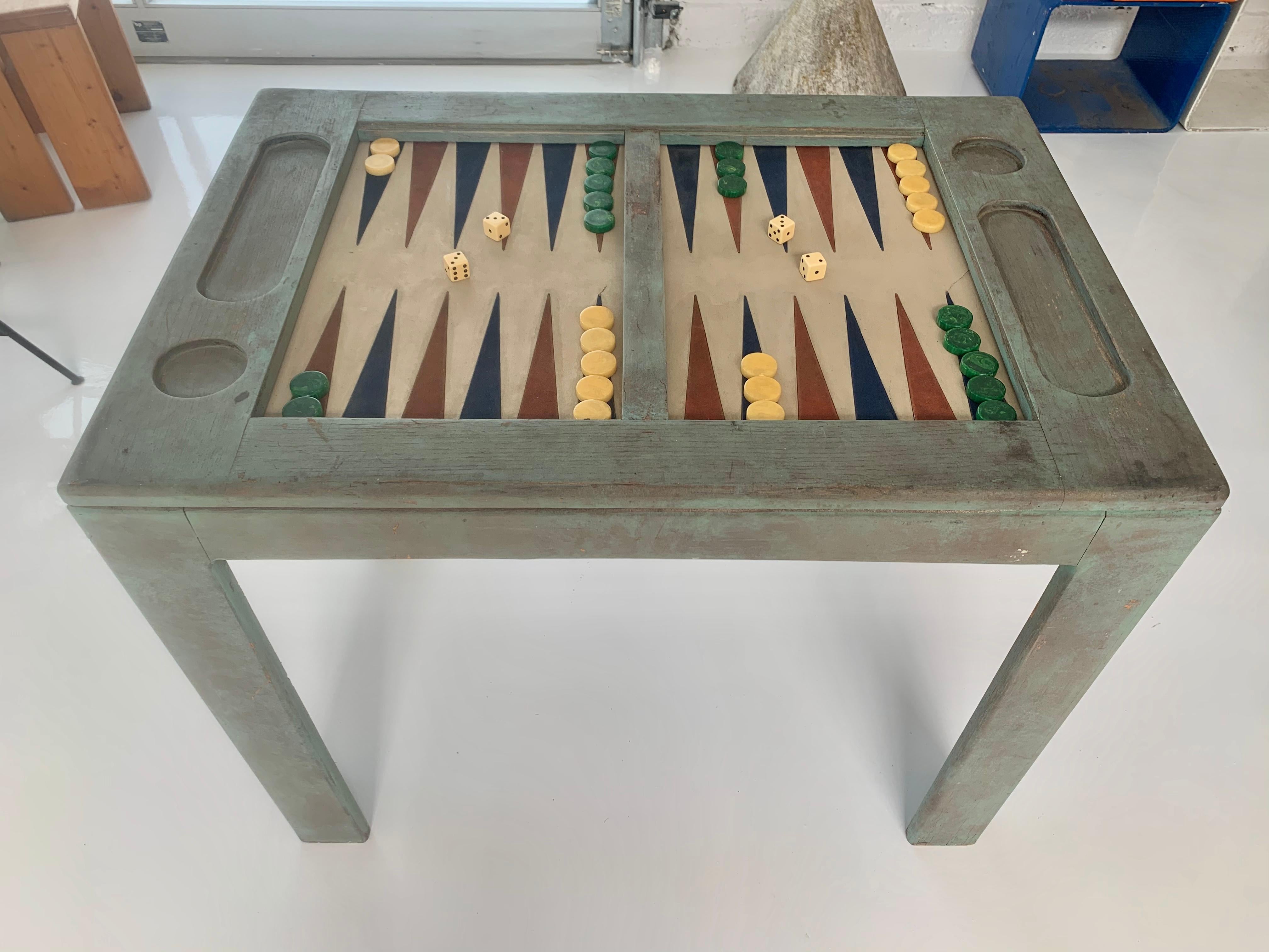 Classic distressed wood backgammon table. Microfiber game board red and blue triangles. Repairs to game board visible in photos. Still presents nicely. Removable glass cover to use as game table when not playing backgammon. Vintage game pieces