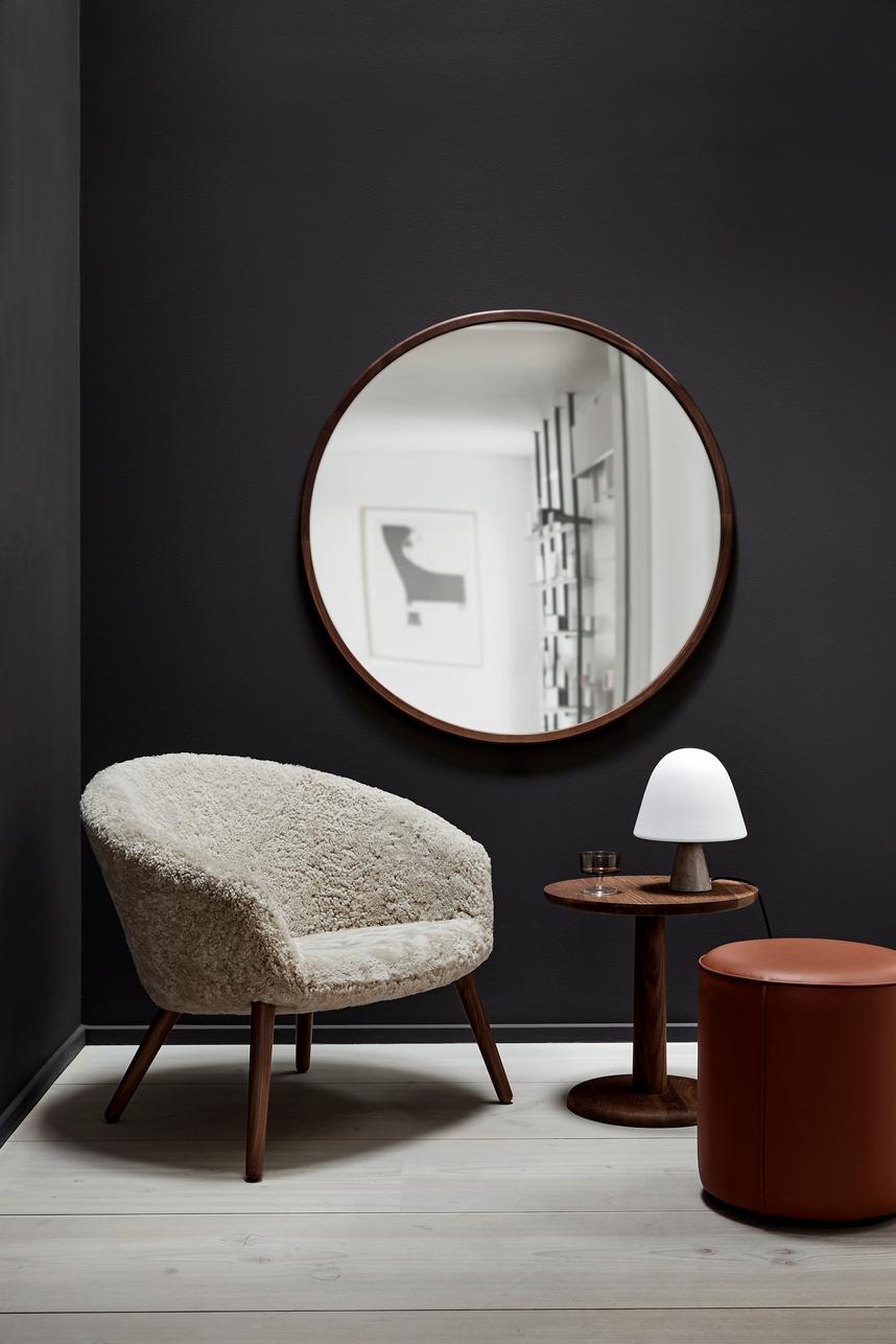 The Ditzel Lounge Chair designed by Nanna Ditzel and Jørgen Ditzel in 1953 offers an intimate space in a comfortable lounge chair without loose cushions. 
The clearly defined shape is imbued with poetic expression, typical of the work of Nanna