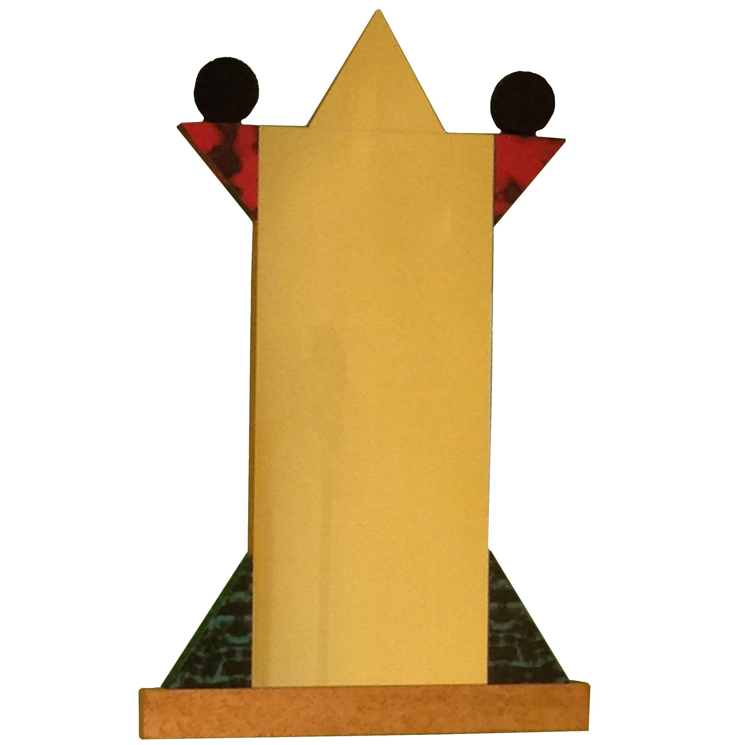 No one but Ettore Sottsass could've designed such an elegant mirror -- an homage to his love of the human psyche, 
