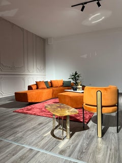 Dubhè sofa in orange nubuck leather with titanium finish metal base