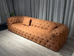Oxford three-seater capitonné sofa in brick-colored nubuck leather