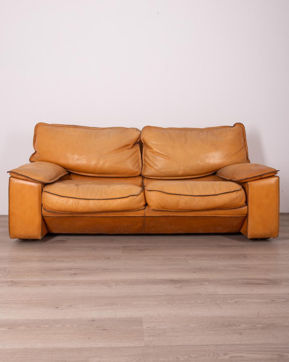 Two-seater sofa with metal and wood frame and beige leather upholstery, 1970s, design Ferruccio Brunati.

CONDITION: In good condition, shows obvious signs of wear given by time.

DIMENSIONS: Height 75 cm; Width 170 cm; Length 90 cm

MATERIAL: