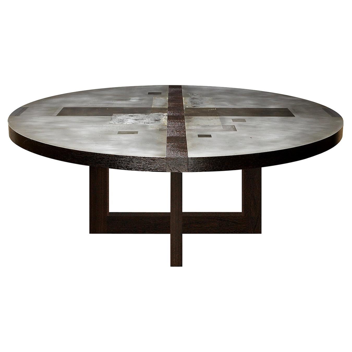 "Tierras divididas" Mesa de comedor redonda de zinc con base de bastidor del artista Florian Roeper