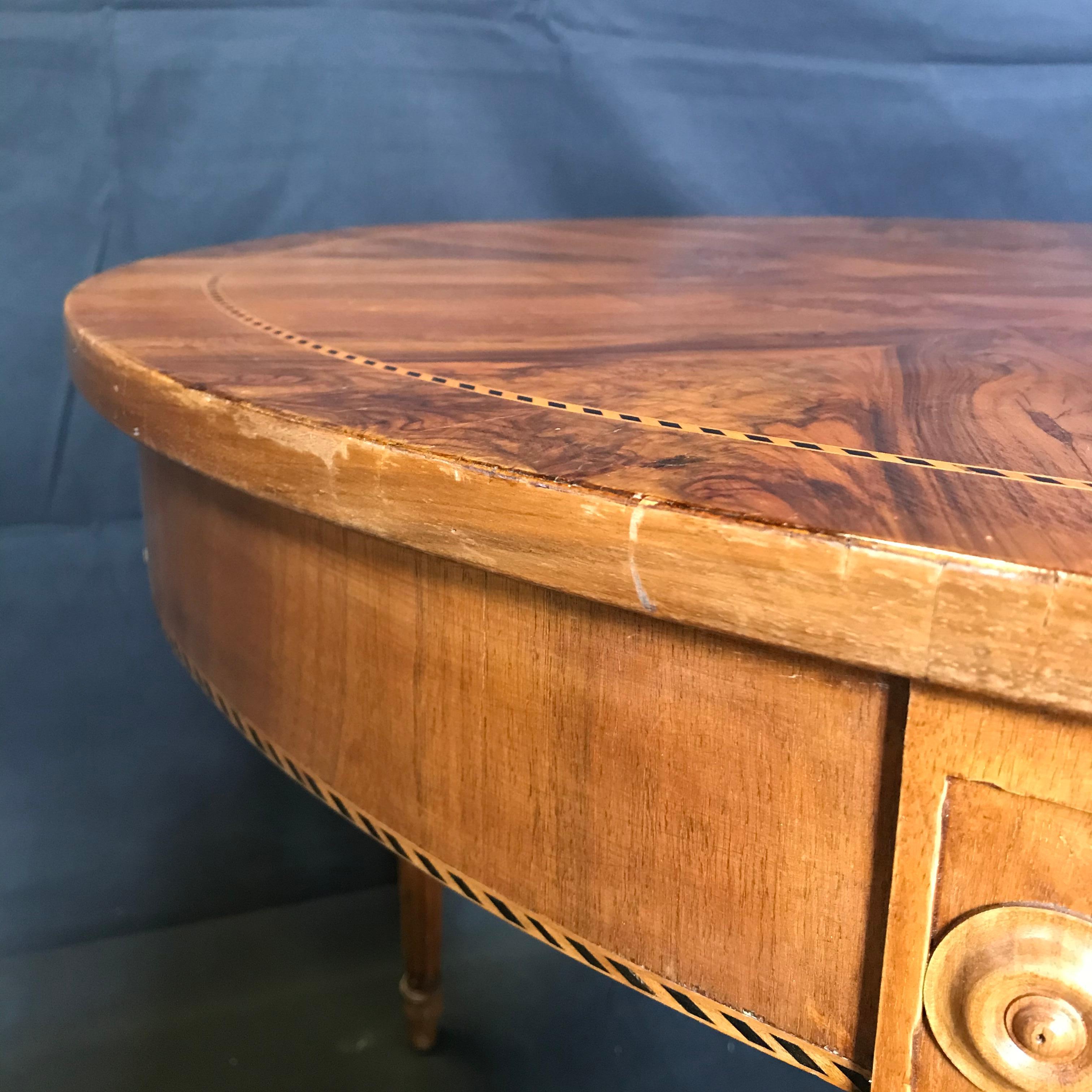 Gorgeous French inlaid round marquetry table with beautiful circular block pattern surrounding the burled walnut center, circa 1880.
#4468
Measure: H skirt 24.25