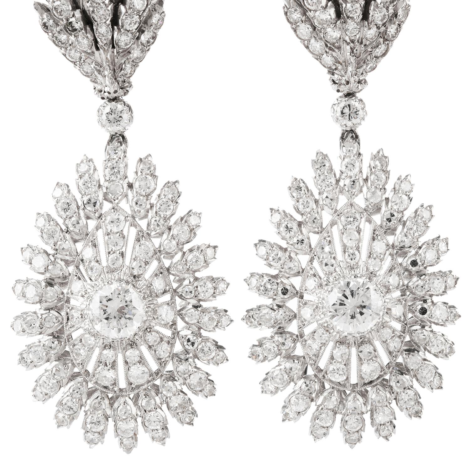 With every movement these elegantly designed Buccellati earrings have sparkle and shine.  Designed in a Peacock motif and crafted in 

Platinum, these earrings dangle freely and offer elegance to any affair. Prong set Diamonds and hand