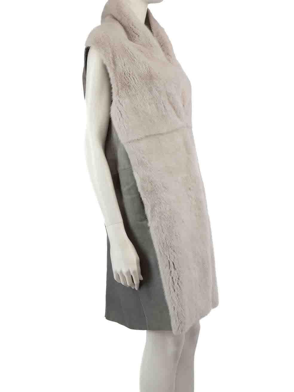 CONDITION is Very good. Minimal wear to jacket is evident. There is a hook missing from the centre front on this used Divine Cashmere designer resale item.
 
 
 
 Details
 
 
 Grey
 
 Mink fur
 
 Vest
 
 Hook fastening
 
 Back leather panel
 
 
 
 

