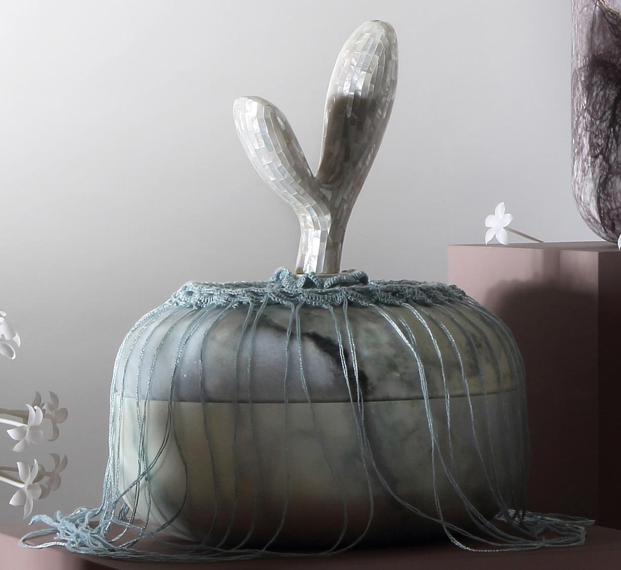Divine Decadence Multifunctional Object in Punta Azul Marble by Richard Yasmine
Dimensions: Vase: Ø 28 x H 20 cm.
Base: Ø 18 x H 10,5 cm.
Head: Ø 14 x H 23,5 cm.
Candleholder: Ø 5 x H 6 cm.
Materials: Punta Azul marble, thread, wood, and mother of