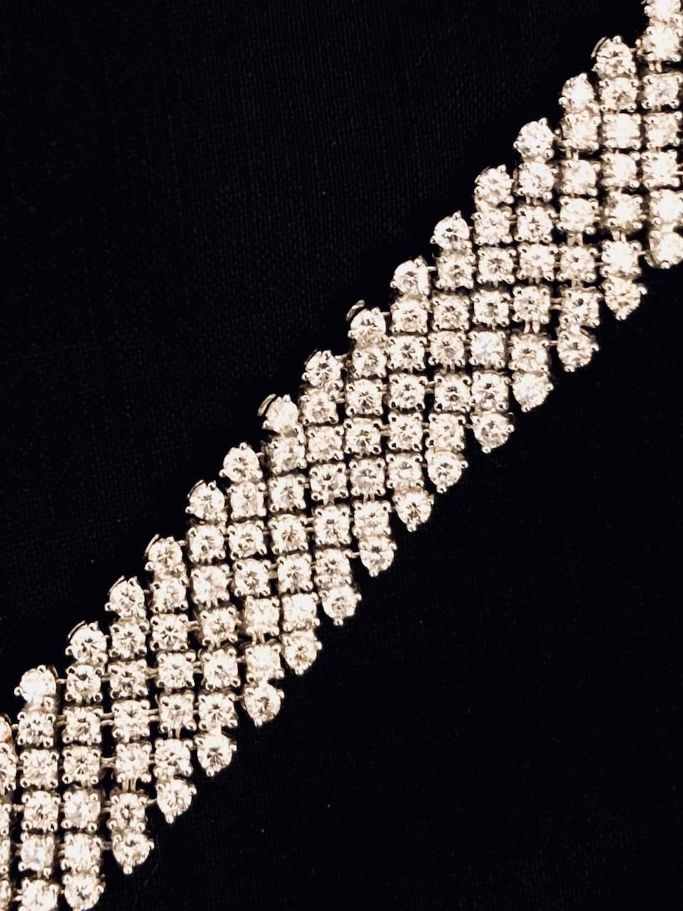 From the 1970's, yet as new as today!  This sparkling all diamond bracelet boasts an impressive approximate total weight of 16.20 carats.  G/H color.  VS/SI clarity.  Top and bottom row round white diamonds are 3 prong set.  Inside rows of round