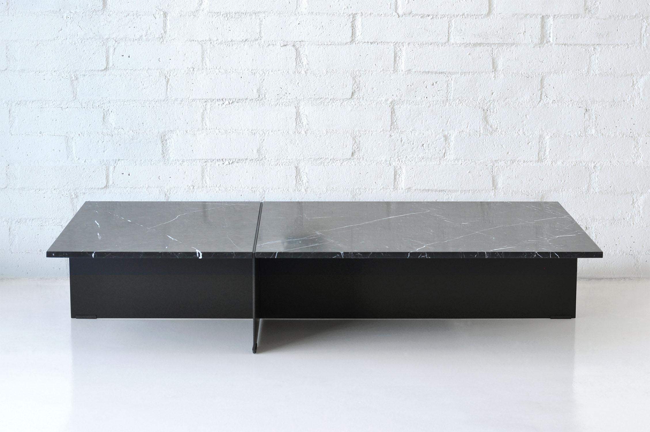 Listed price is for the Division Coffee Table- Rectangular coffee table with either a travertine, white carrara, or negro marquna top, and Flat Black or Flat White powder coat base. 

Prices exclude packing.

Collection of architecturally